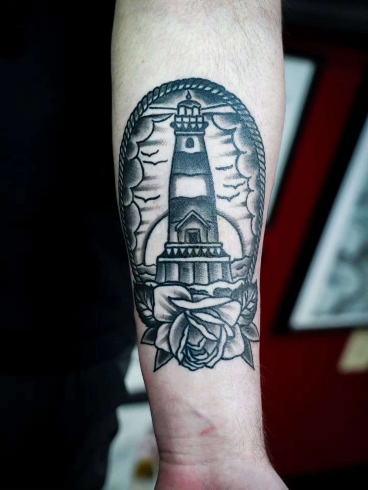 Lighthouse American traditional tattoo on the forearm by Spicoli