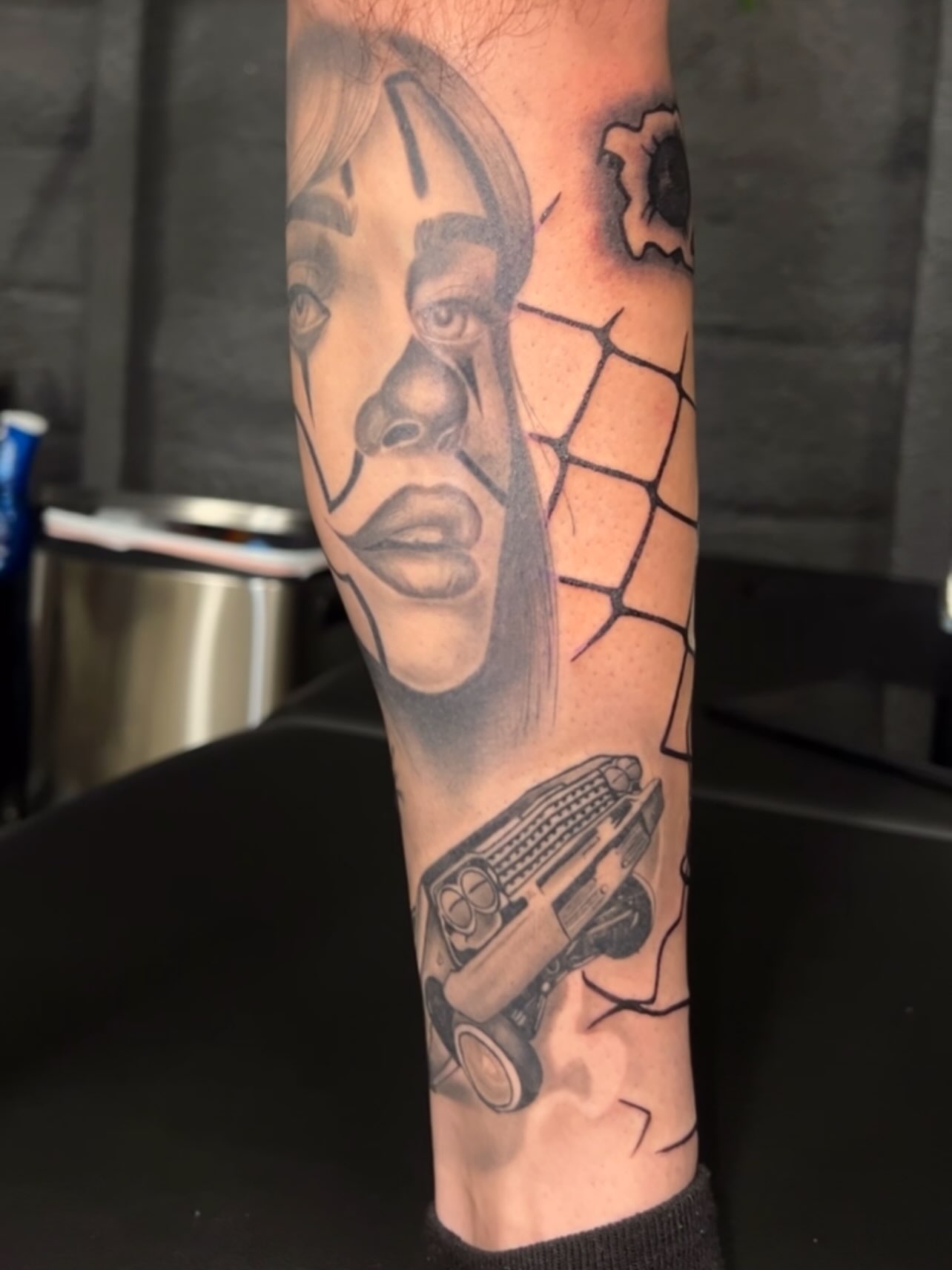Portrait with car realism tattoo on the forearm by Dallas tx tattoo artist ✝️
