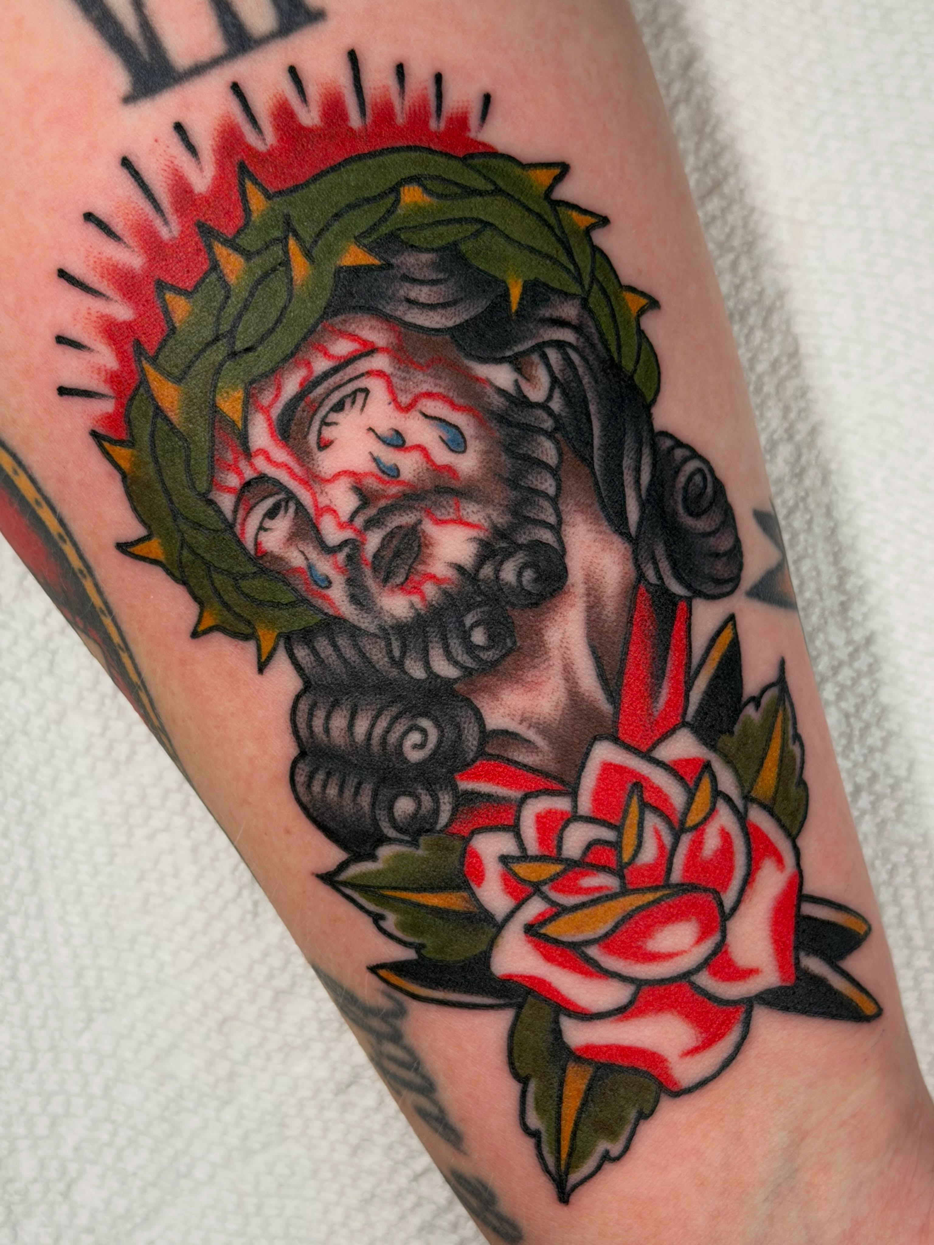 Jesus Christ American traditional tattoo on the forearm by Colbylee Tattoo Norwich