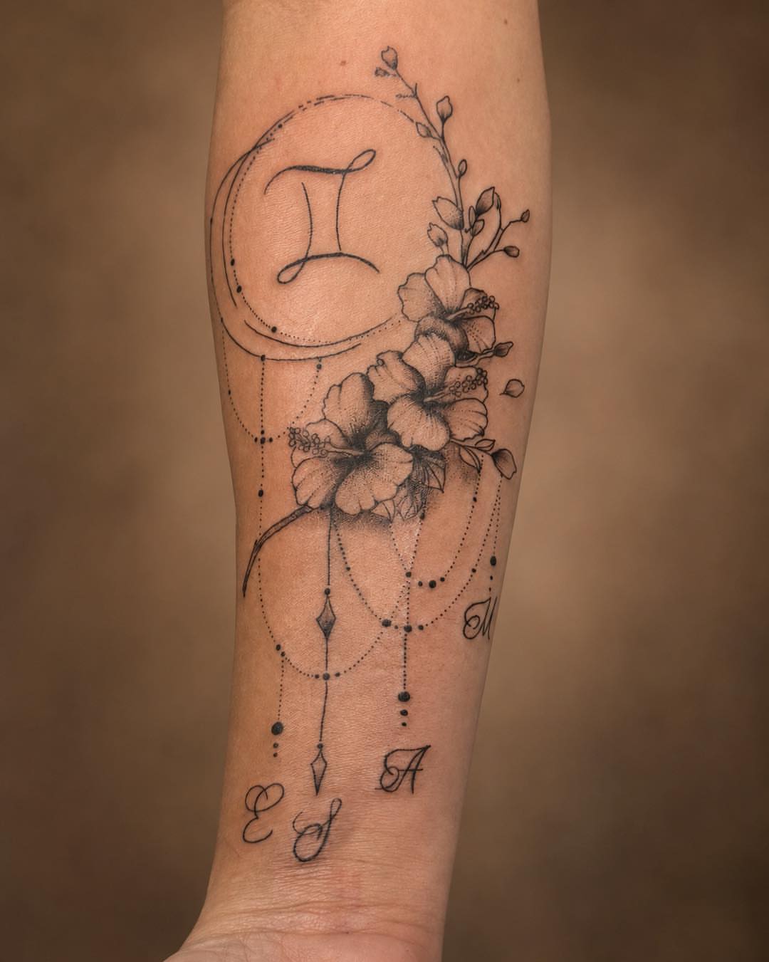 Floral arrangement with geometric elements dotwork tattoo on the forearm by Flamboyant