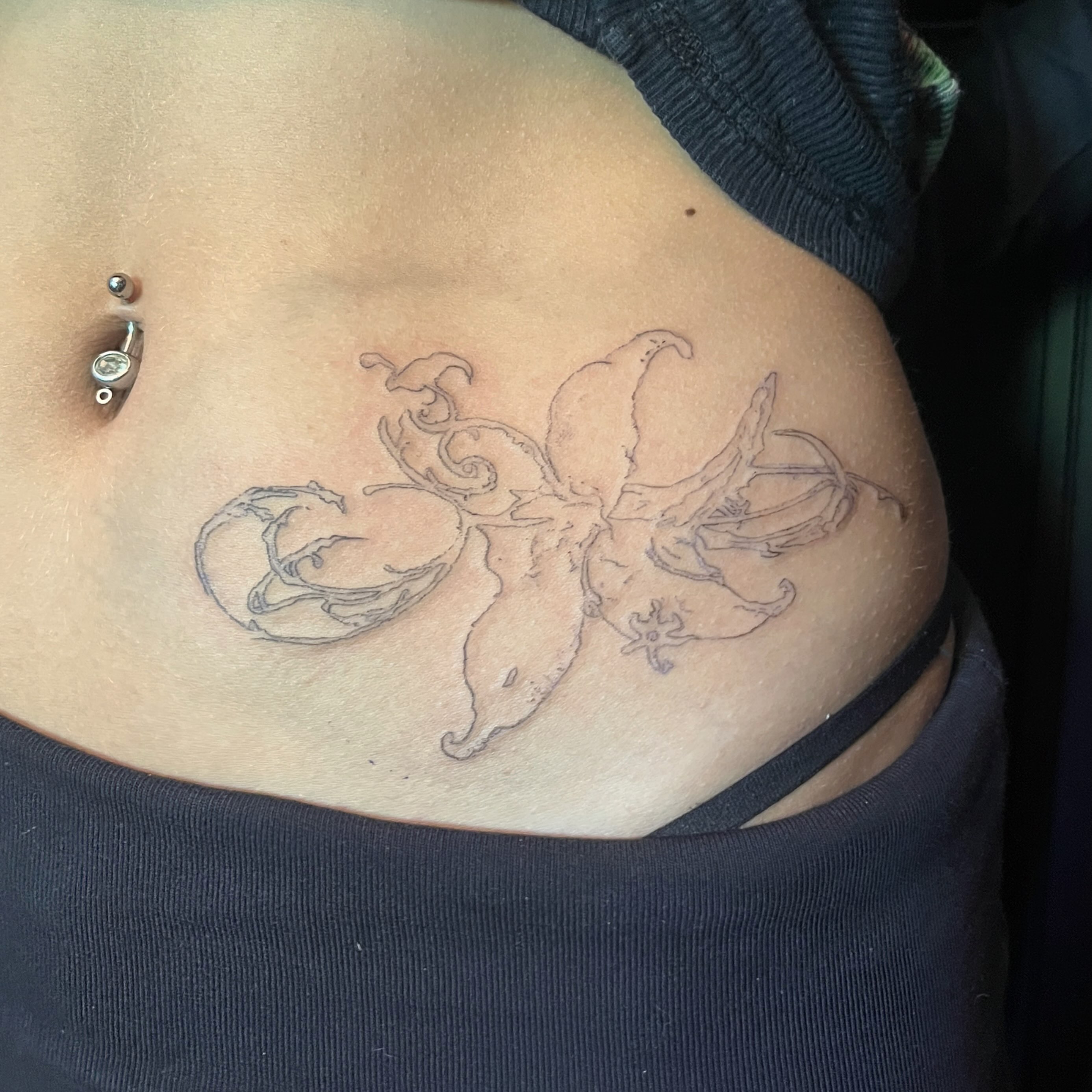 Octopus black and grey tattoo on the torso by kacper