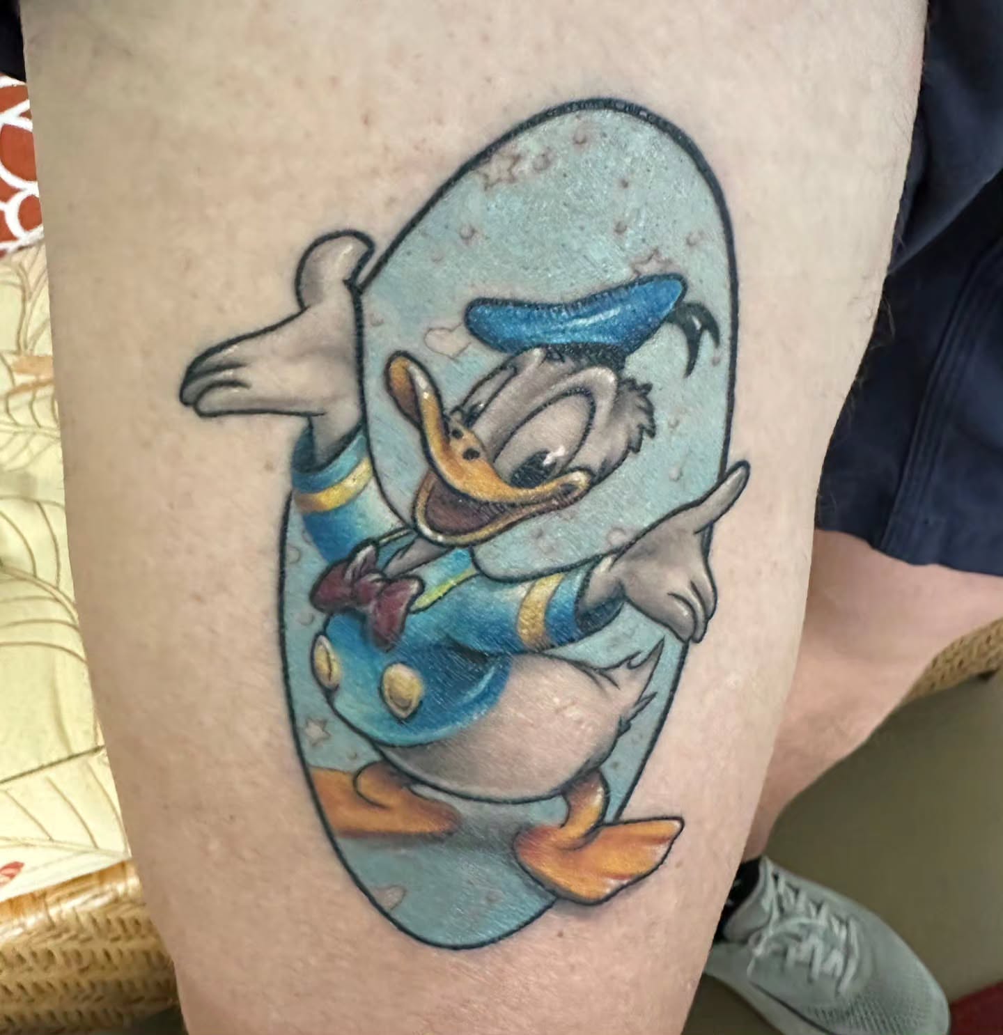 Donald duck new school tattoo on the thigh by Kosta