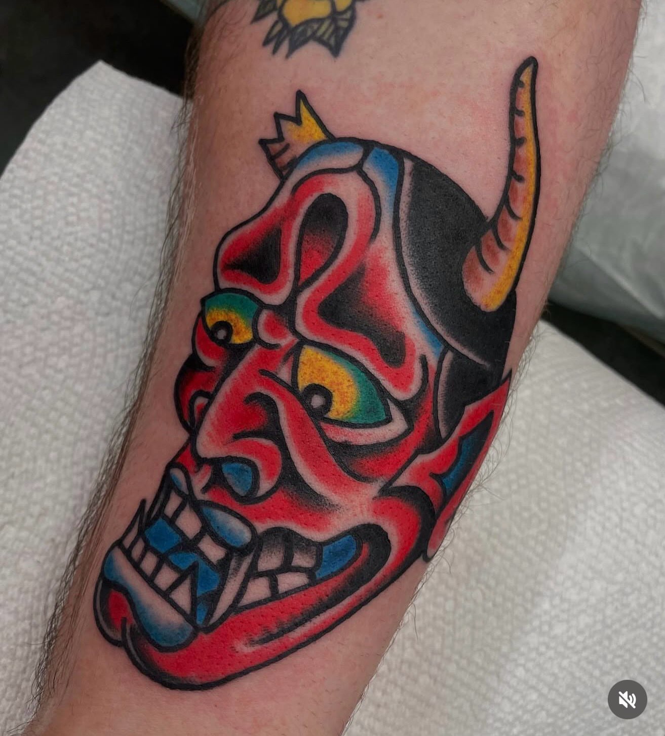 Skull mask American traditional tattoo on the forearm by dave rash