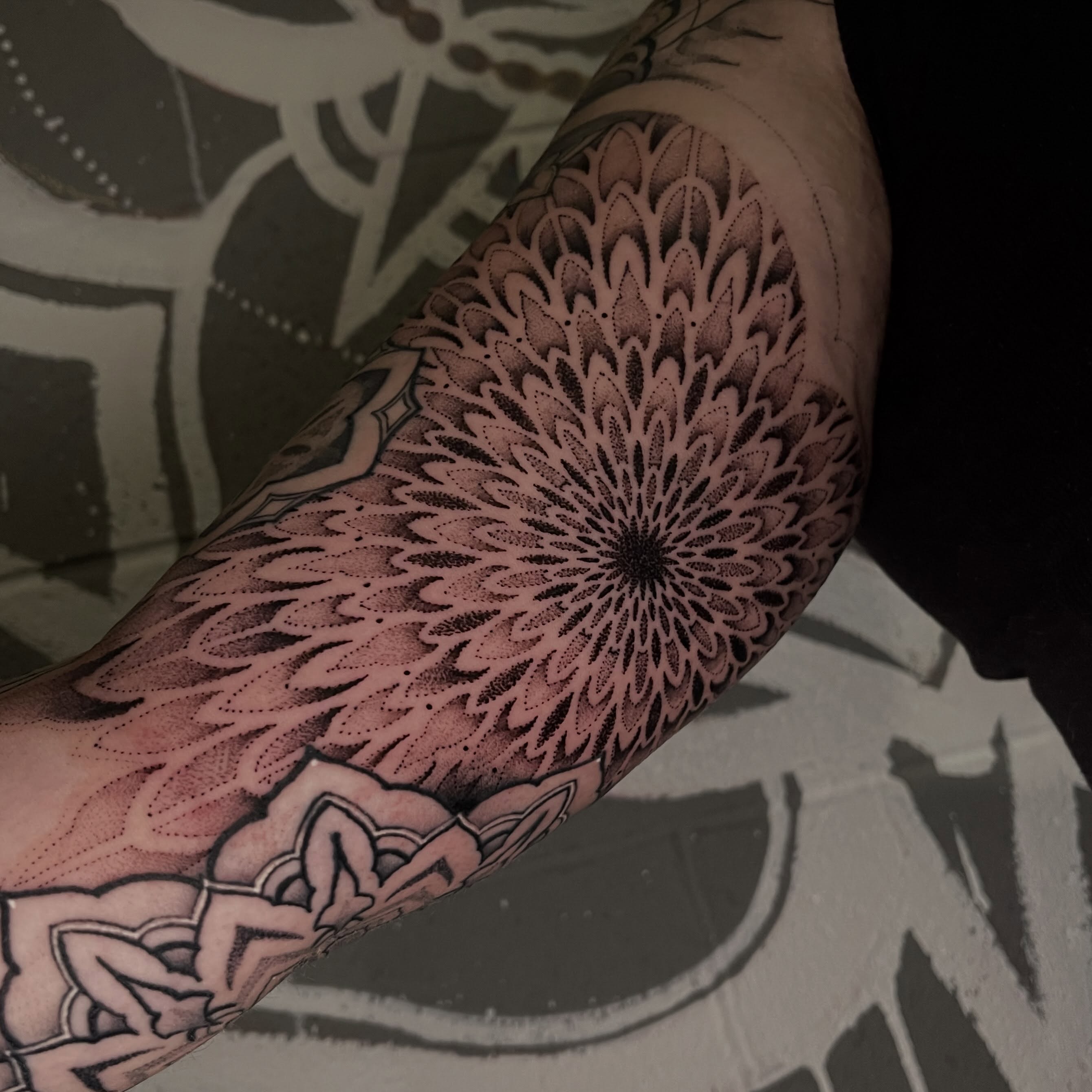 Geometric mandala dotwork tattoo on the forearm by Brandon Mola, Chicago, Illinois