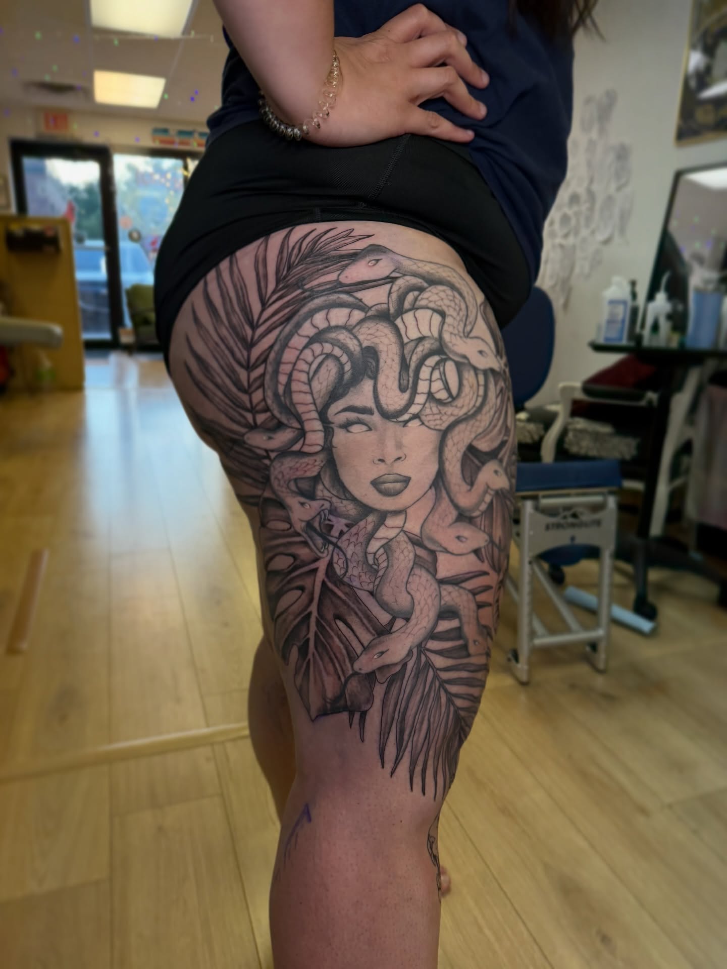 Medusa realism tattoo on the thigh by Dani Fried Tattoos