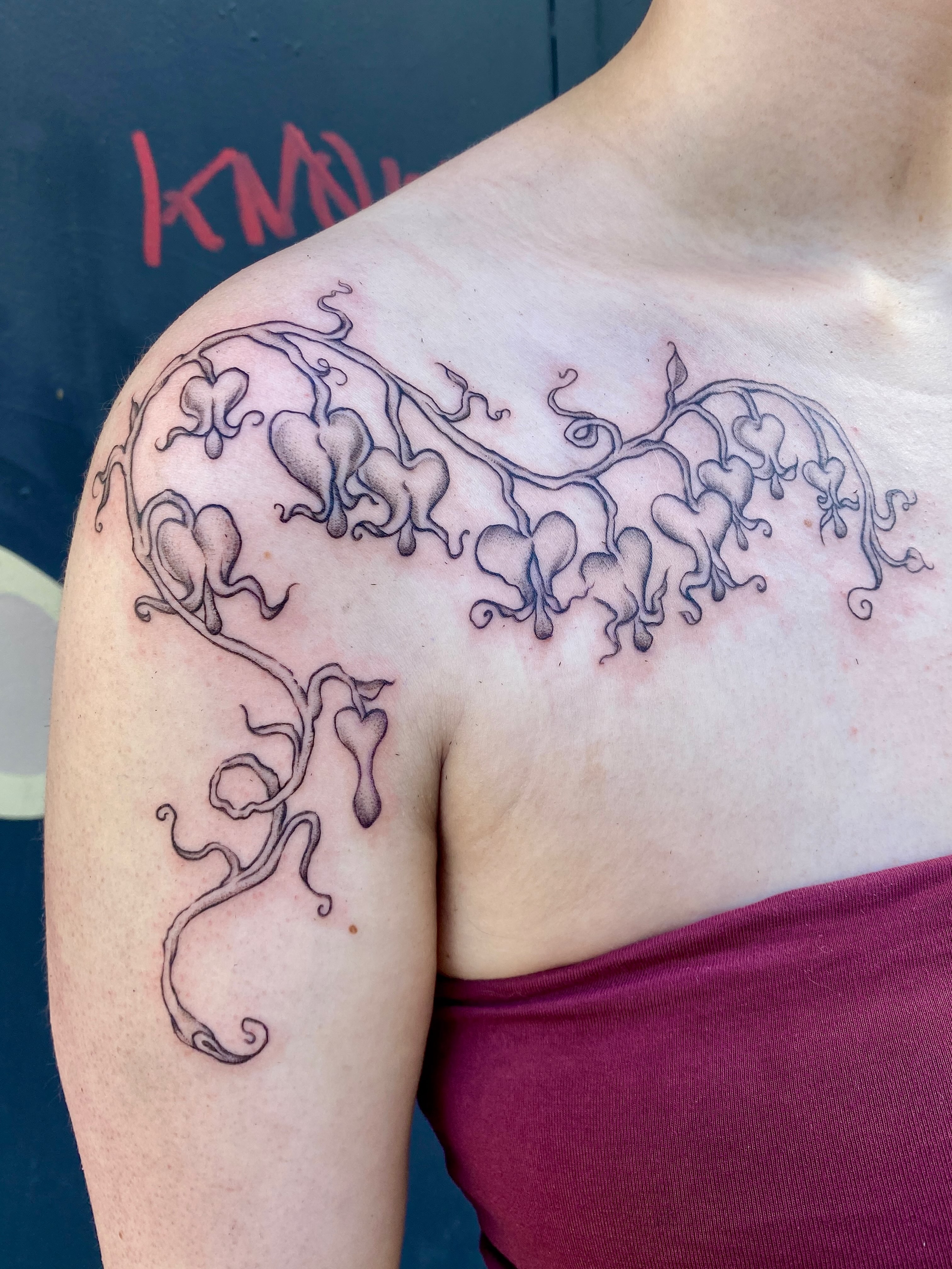Bleeding heart flowers tattoo on the shoulder by °₊⊹ delia ✩ jane ೃ࿔*