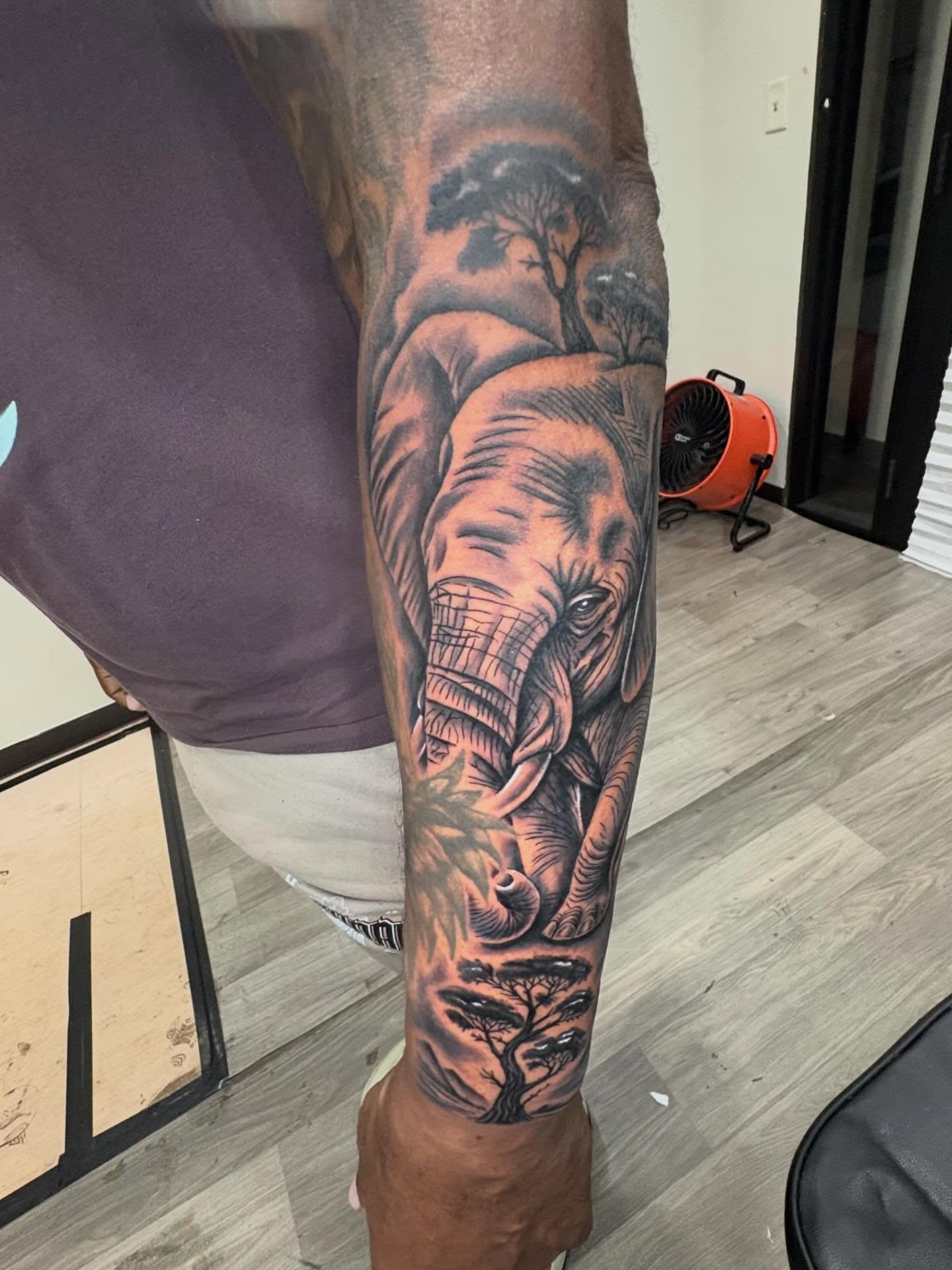 Elephant and trees realism tattoo on the forearm by 𓂀 𝕊ℍ𝔼𝕃𝕃𝕐 𓂀