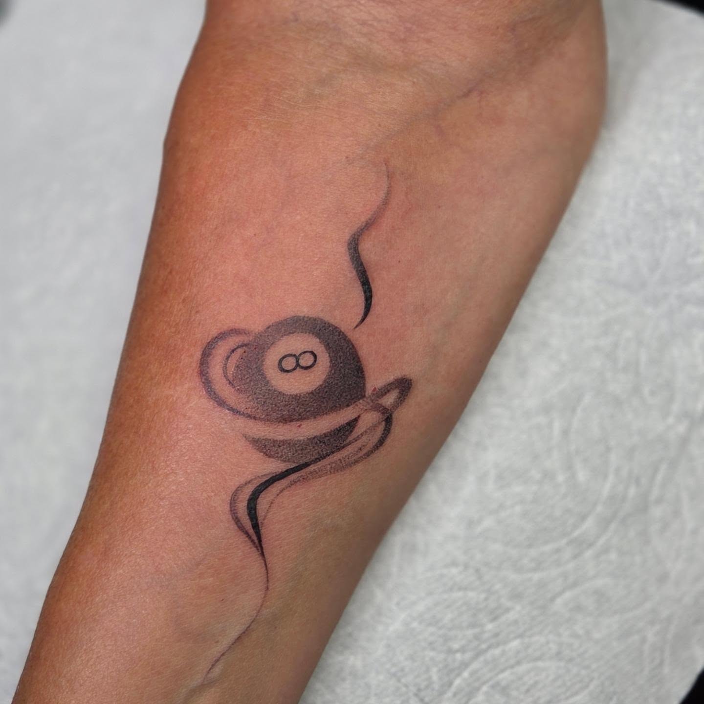 Coffee cup black and grey tattoo on the forearm by Yvette Cebreros