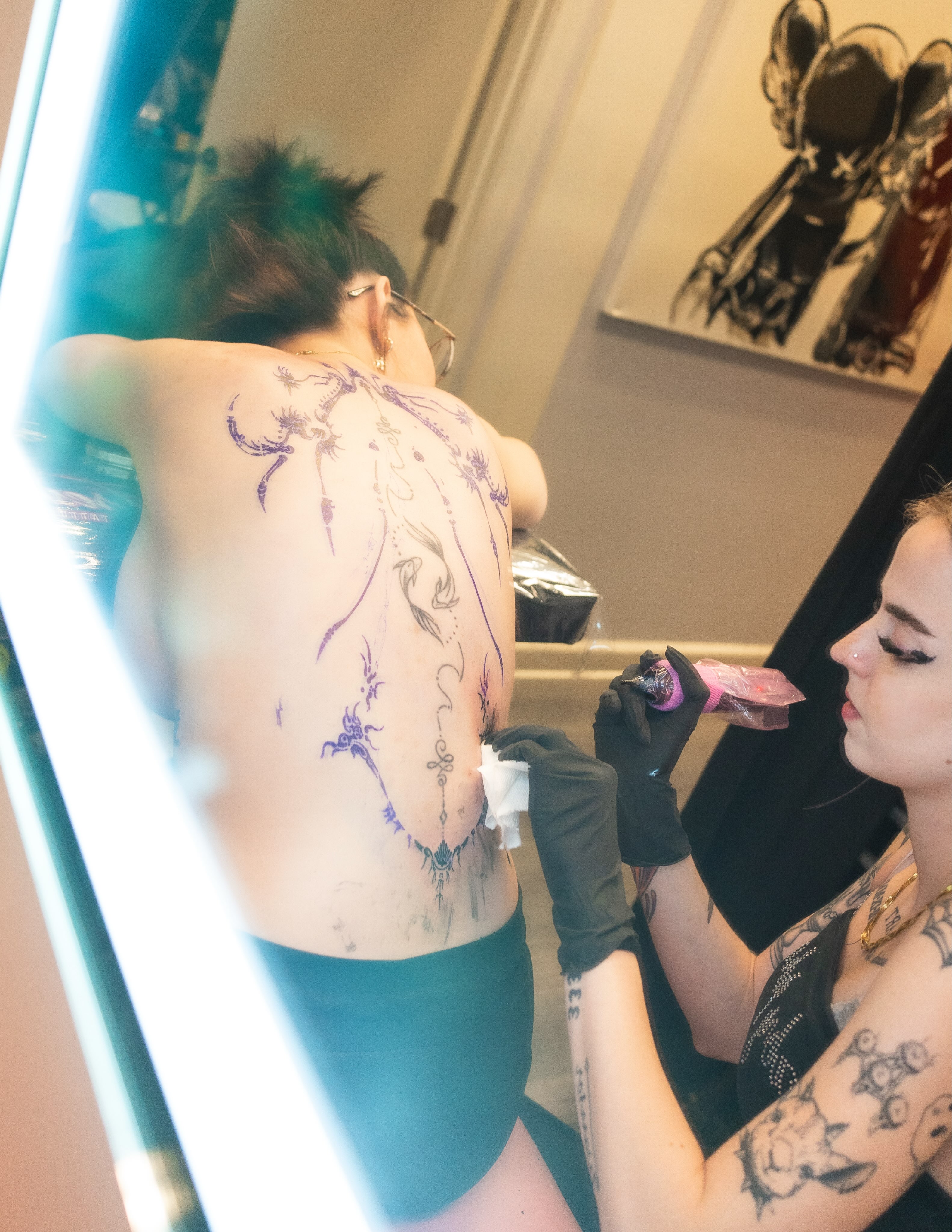 Abstract design dotwork tattoo on the back by Brinkley McGill
