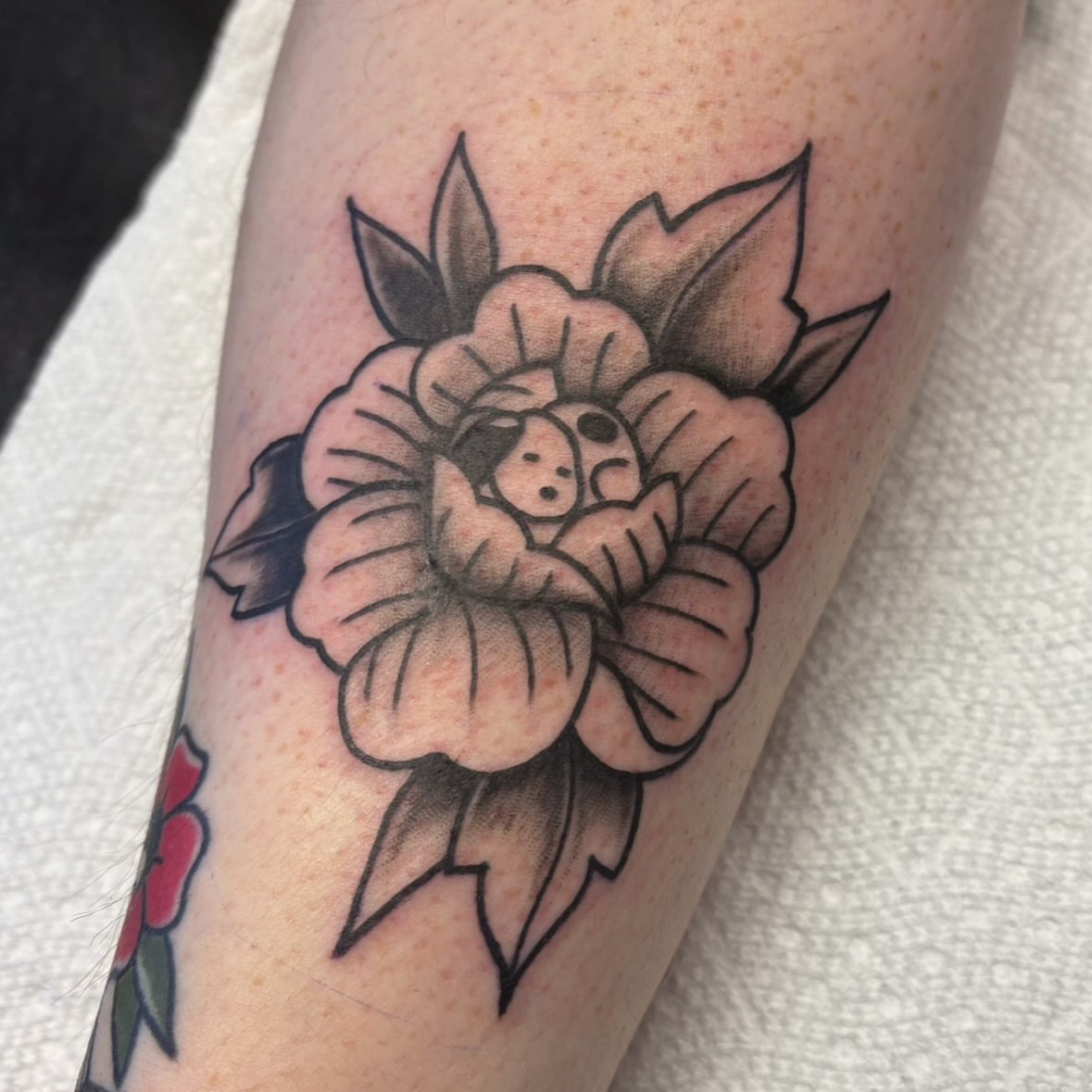 Flower with ladybug American traditional tattoo on the forearm by ♡ Demi ♡