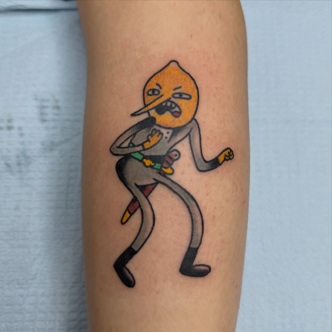 Lemon character new school tattoo on the forearm by Carl Testi