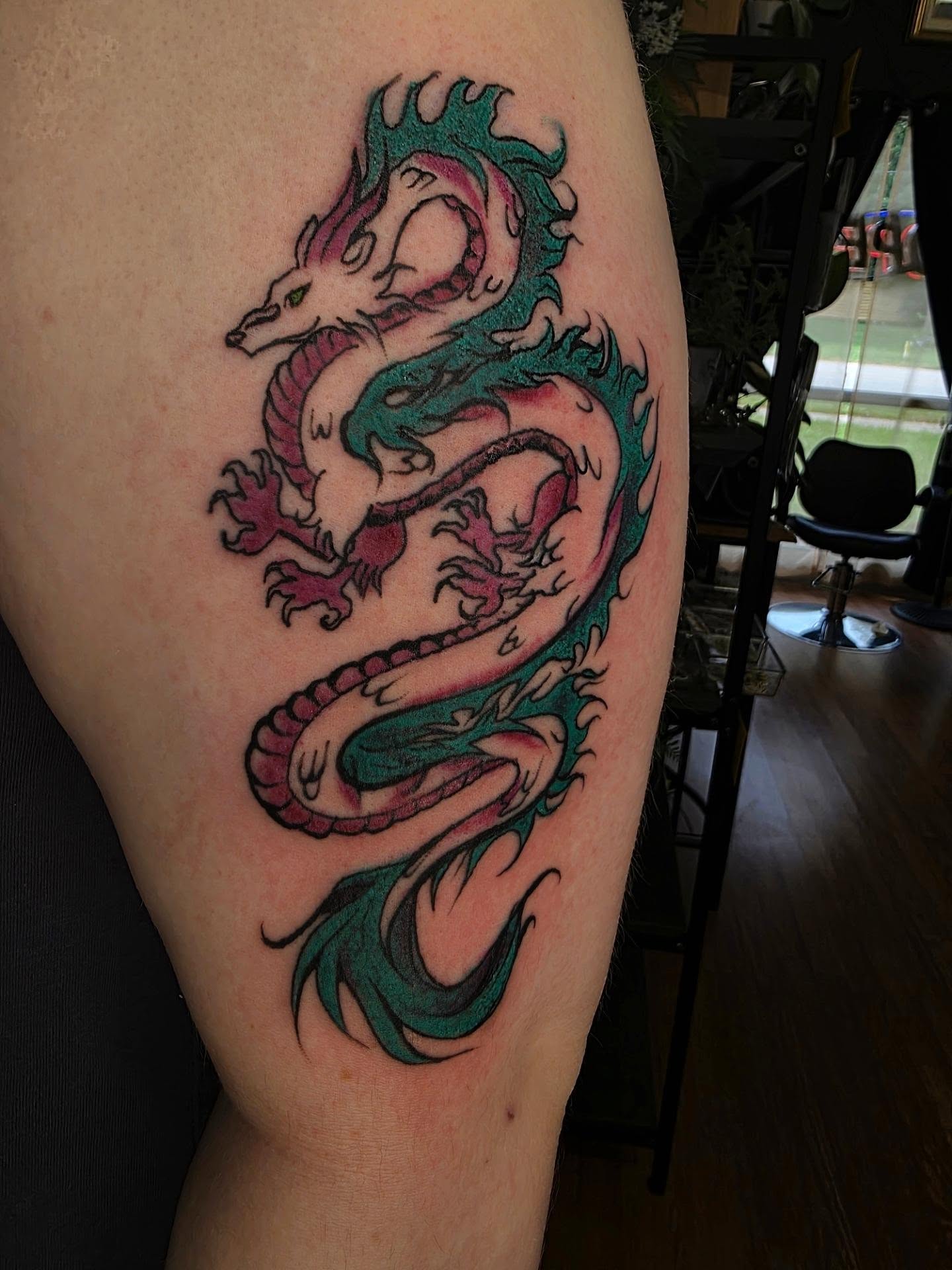 Dragon new school tattoo on the thigh by julian