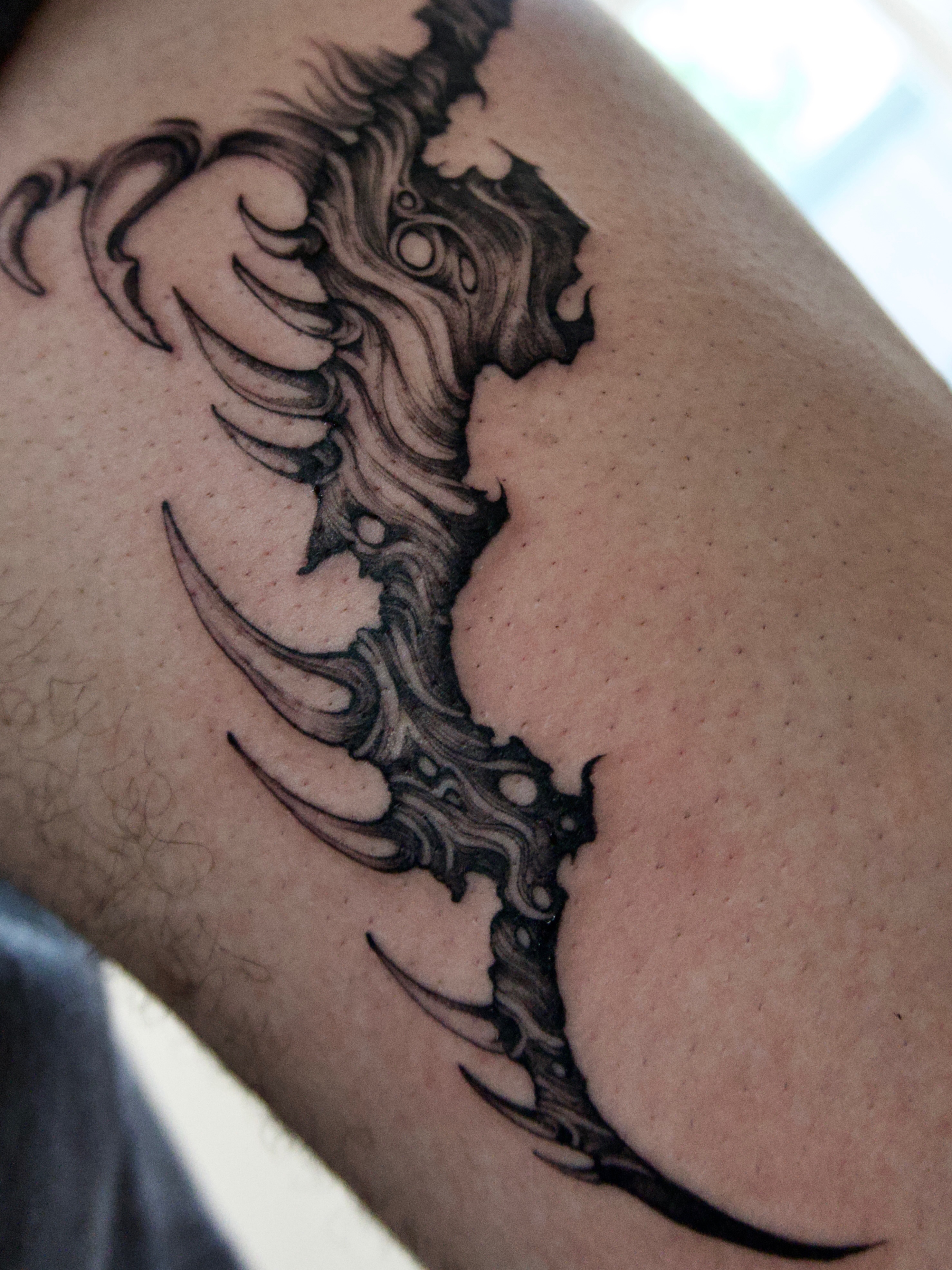 Abstract design black and grey tattoo on the forearm by Oori