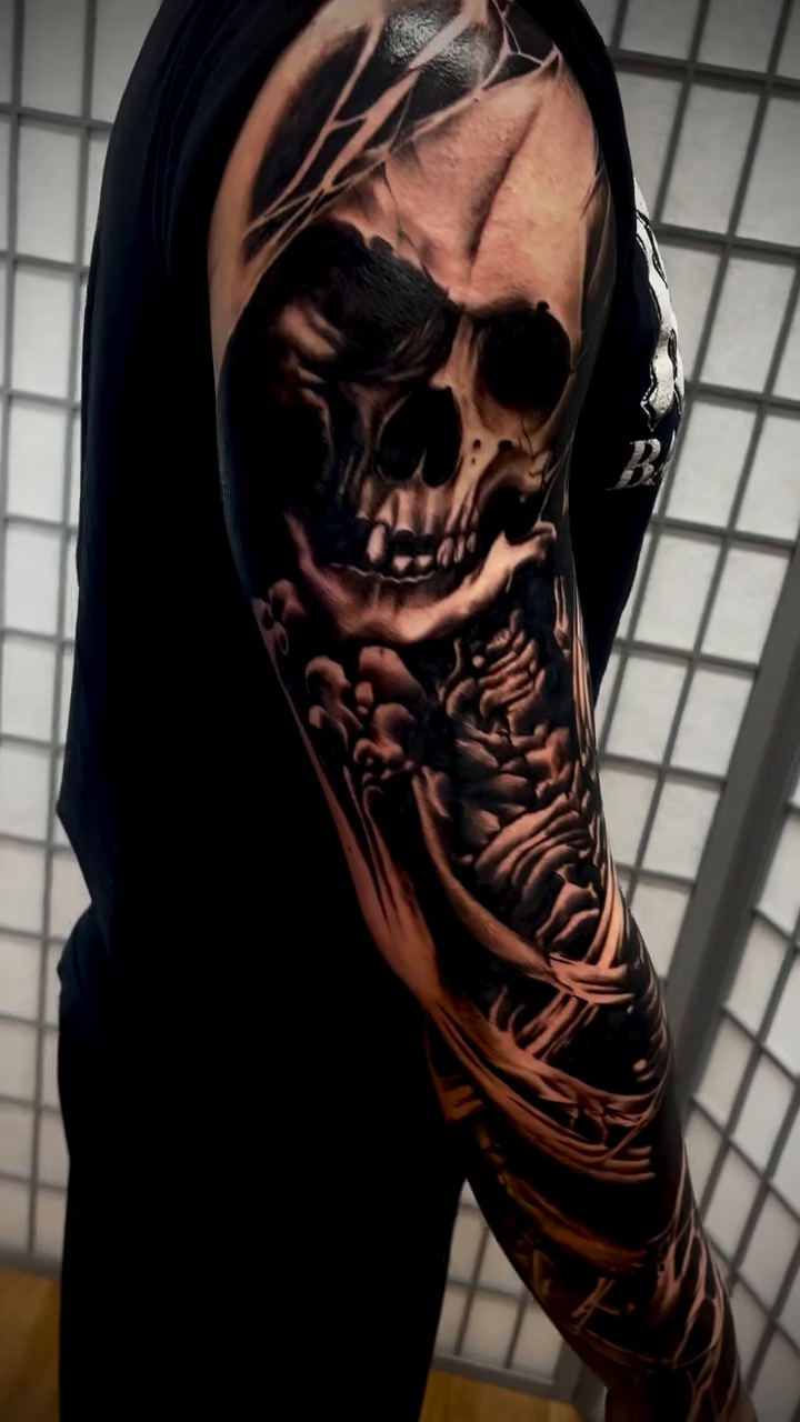 Tattoo by @eastofnoir — dark_realism, black_and_grey