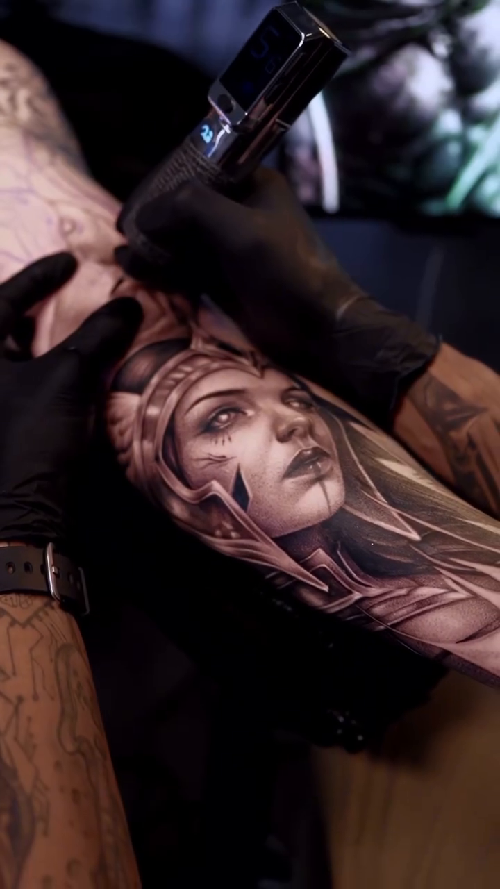 Woman's portrait realism tattoo by Vicman Tattoo