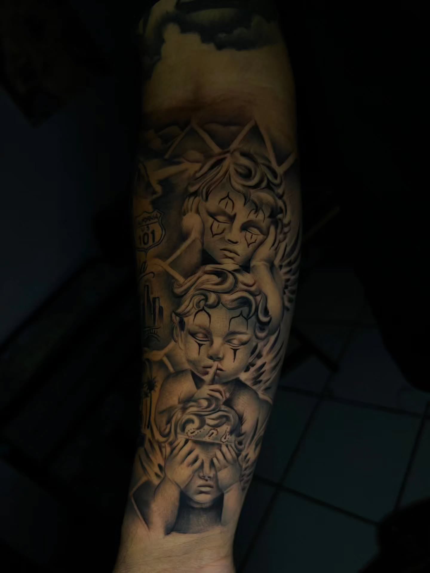 Angels realism tattoo on the forearm by El Salvador Tattoo Artist