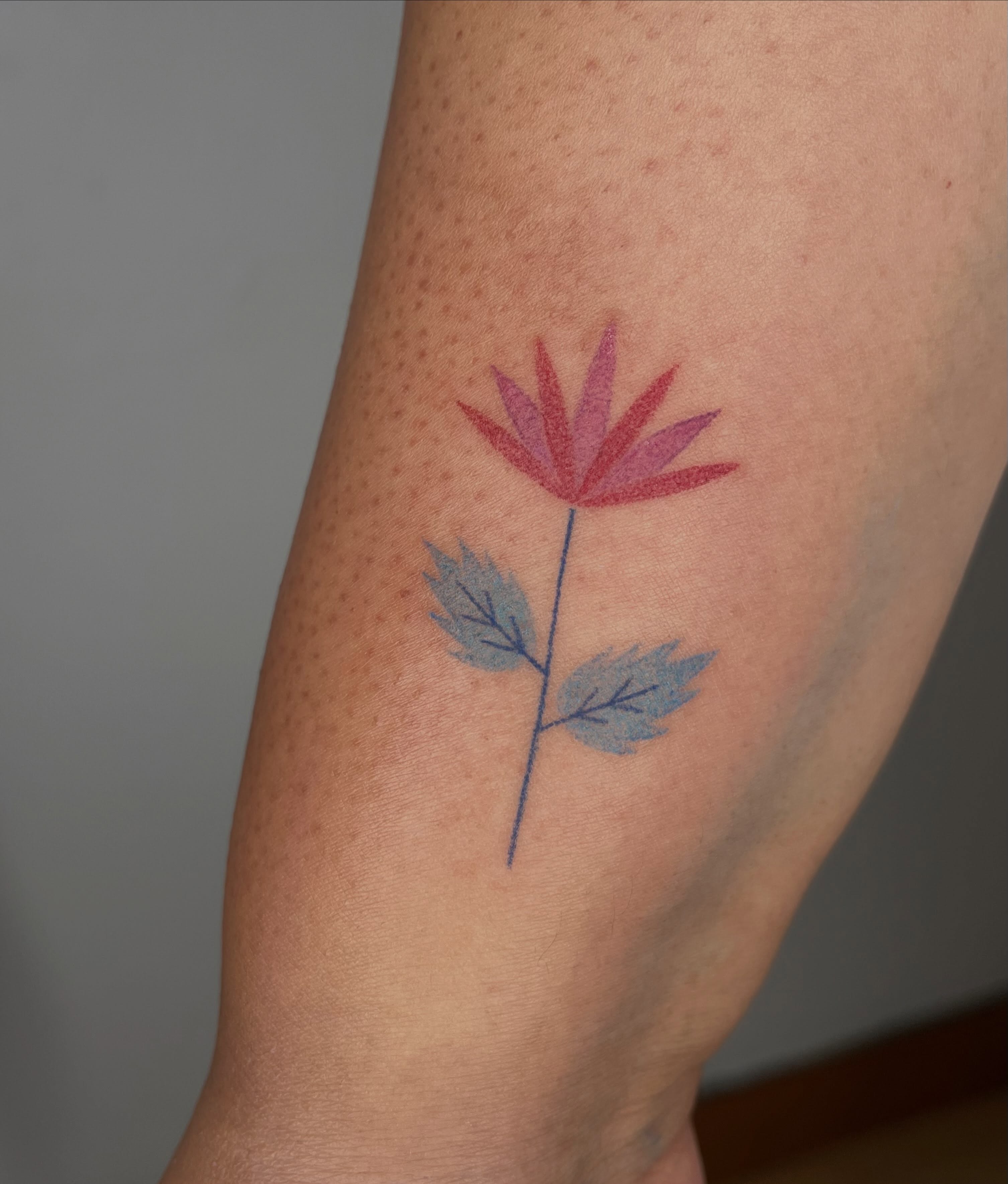 Flower dotwork tattoo on the forearm by Jenna