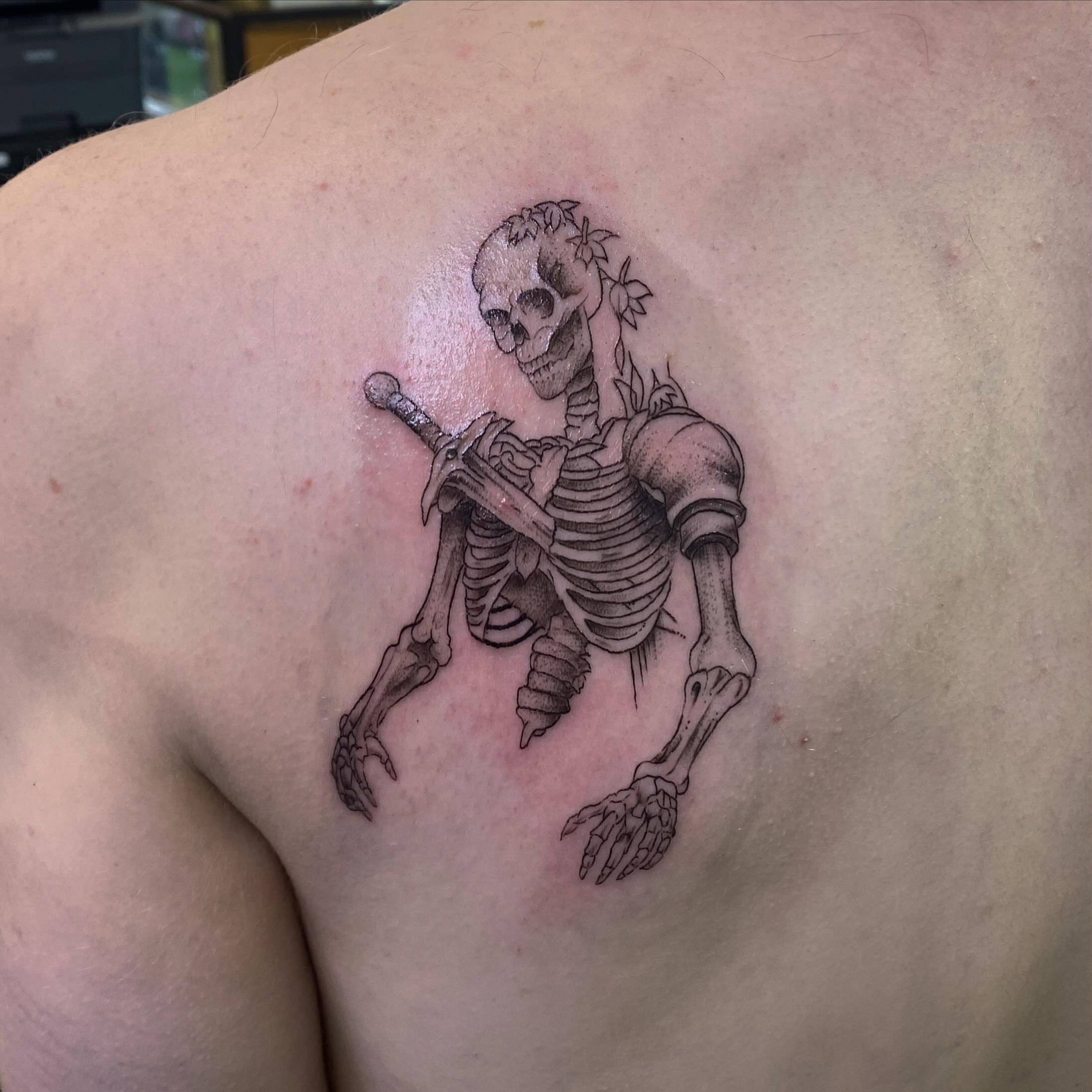Skeleton with sword black and grey tattoo on the back by Spencer Jones Tattoos