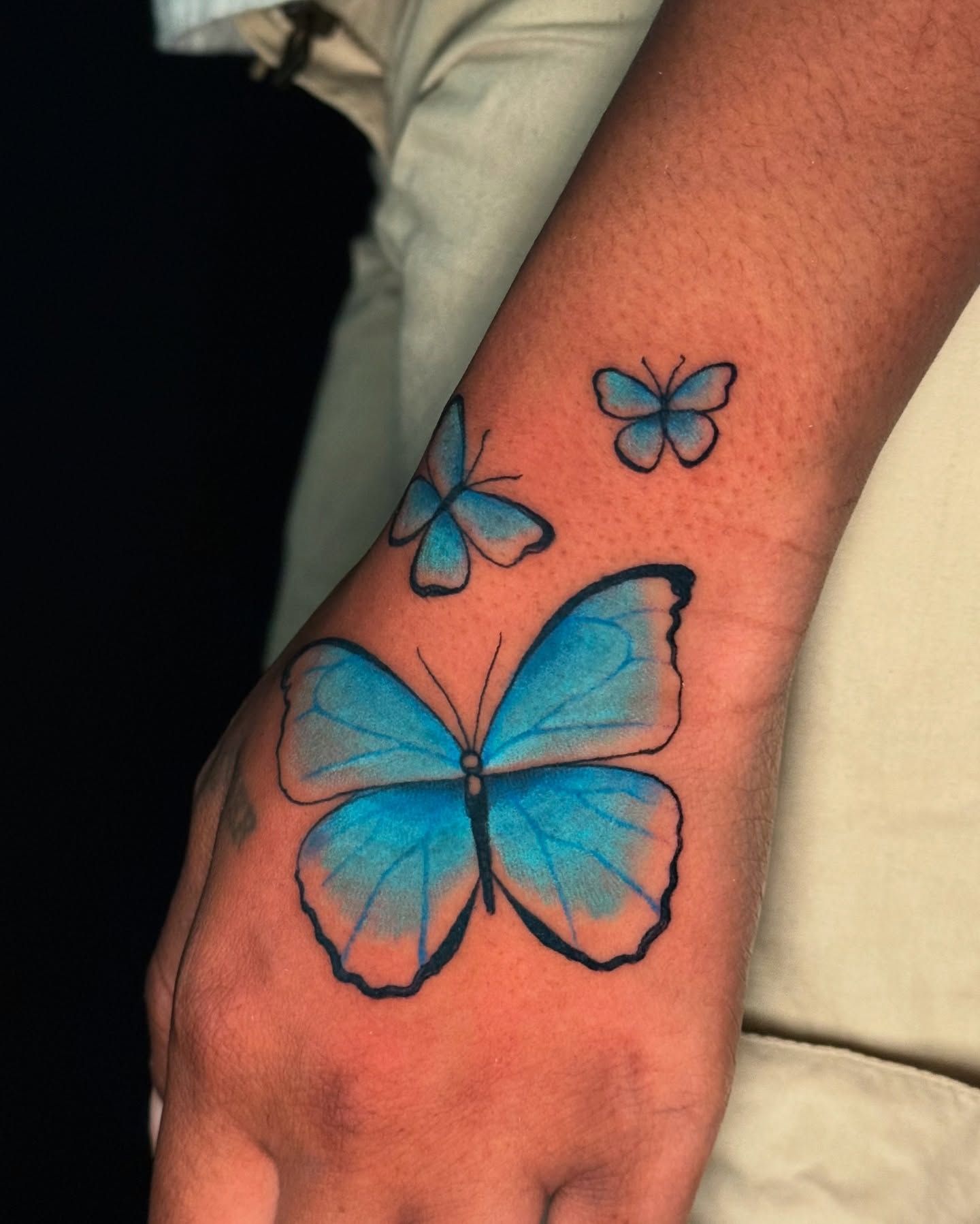 Butterfly watercolor tattoo on the forearm by marlena borscheid