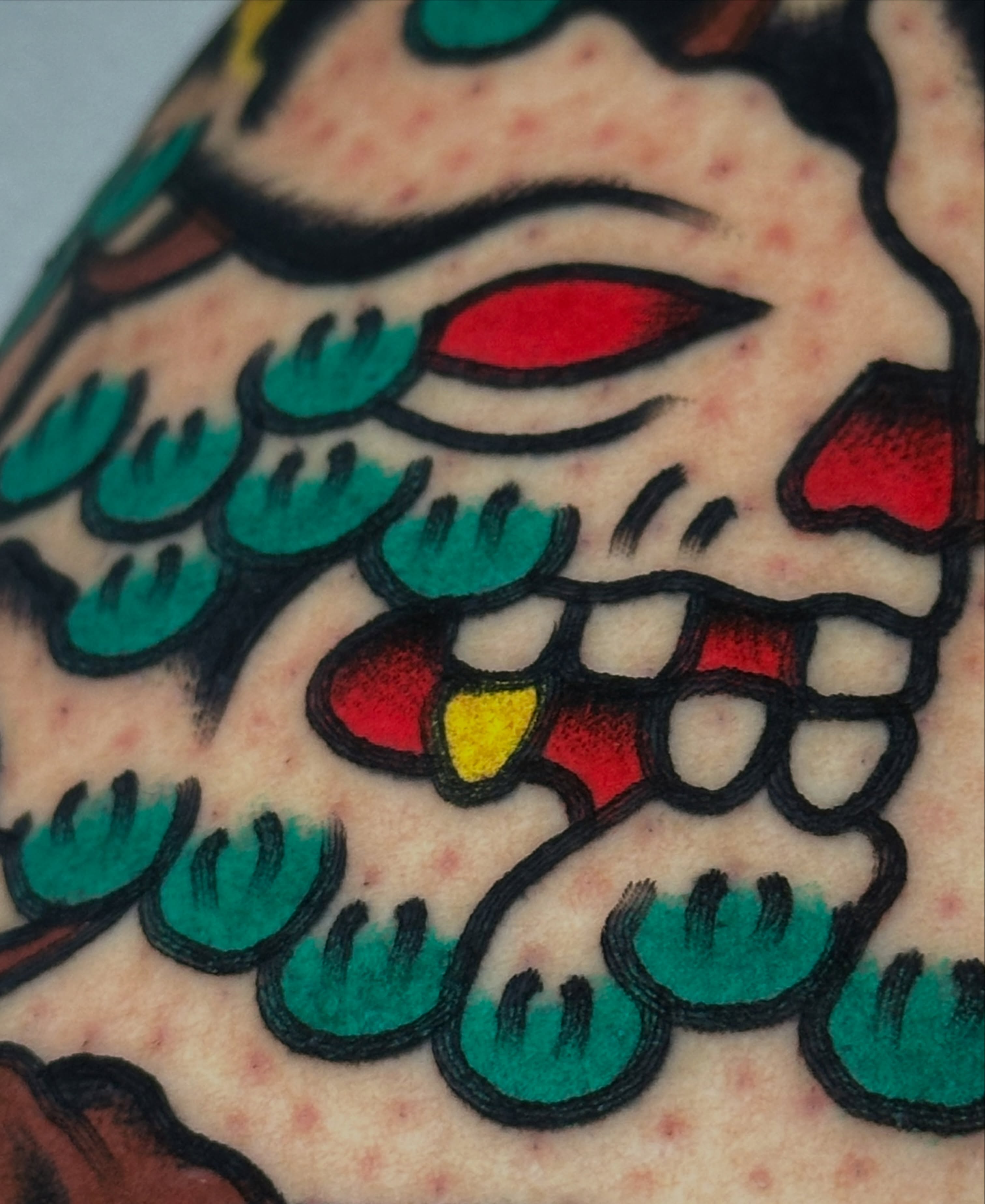 Skull American traditional tattoo on the forearm by Christian Rieben