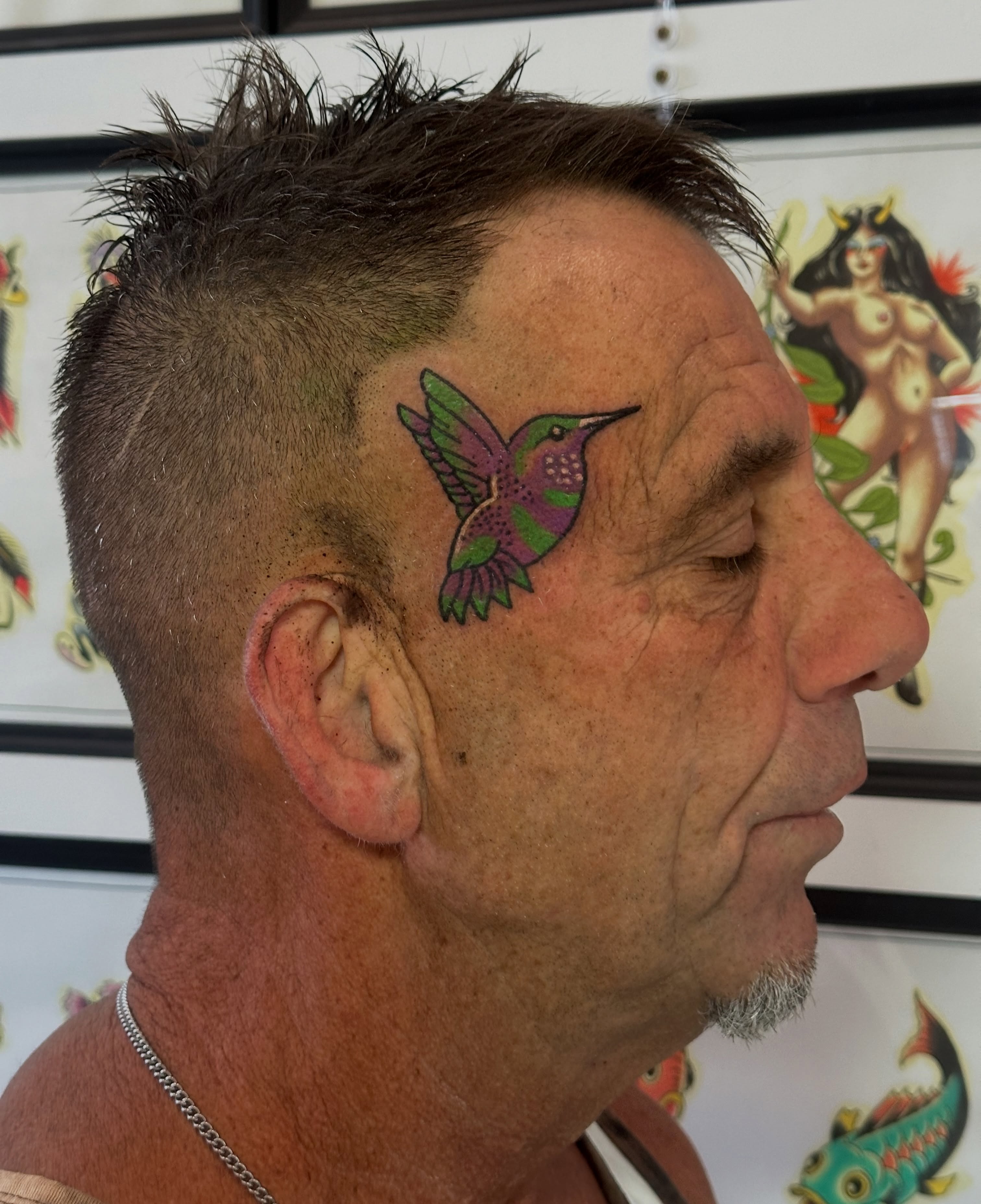 Hummingbird American traditional tattoo on the head by Christian Rieben