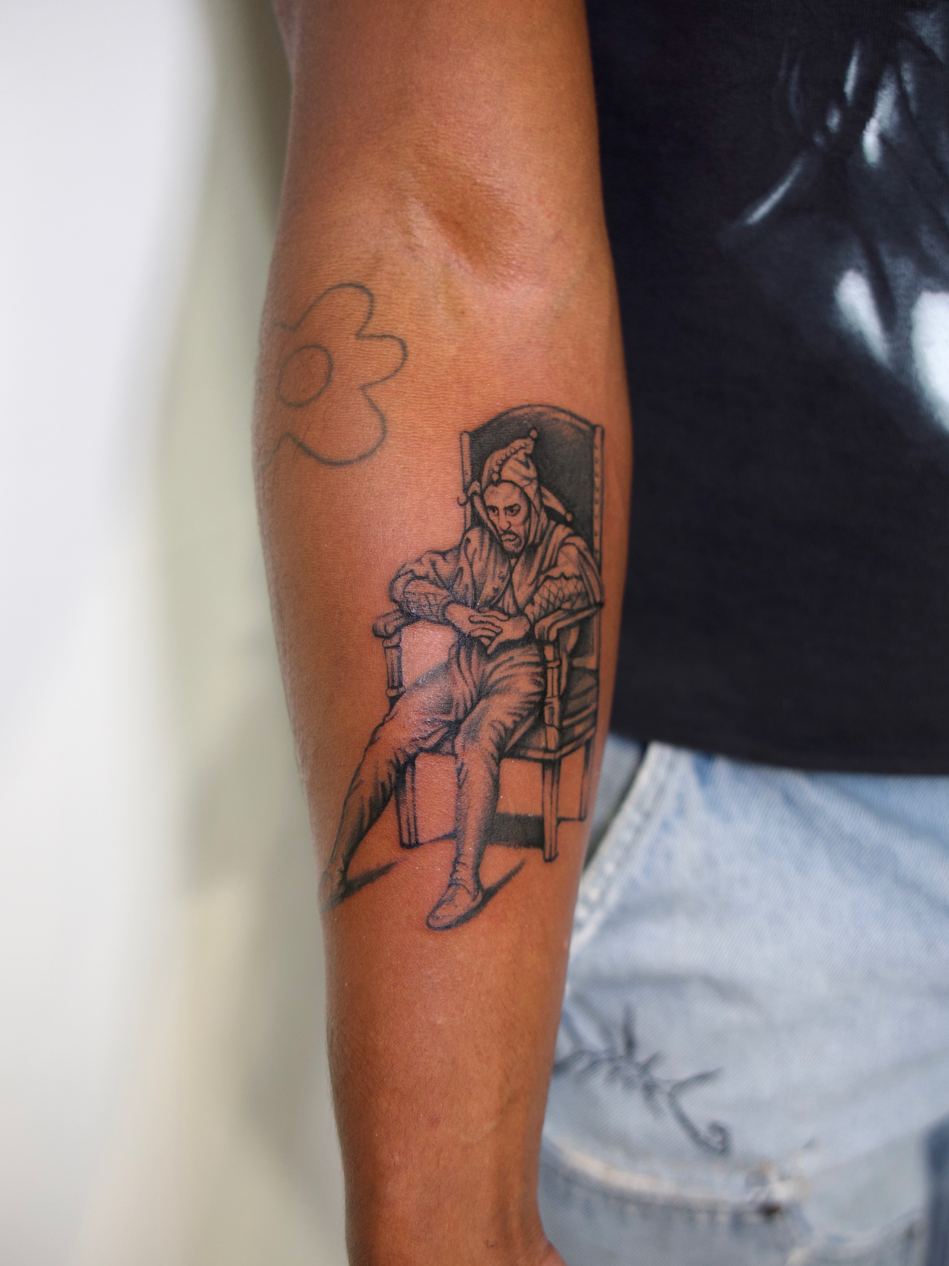 Man in robe black and grey tattoo on the forearm by @lovechasetattoo