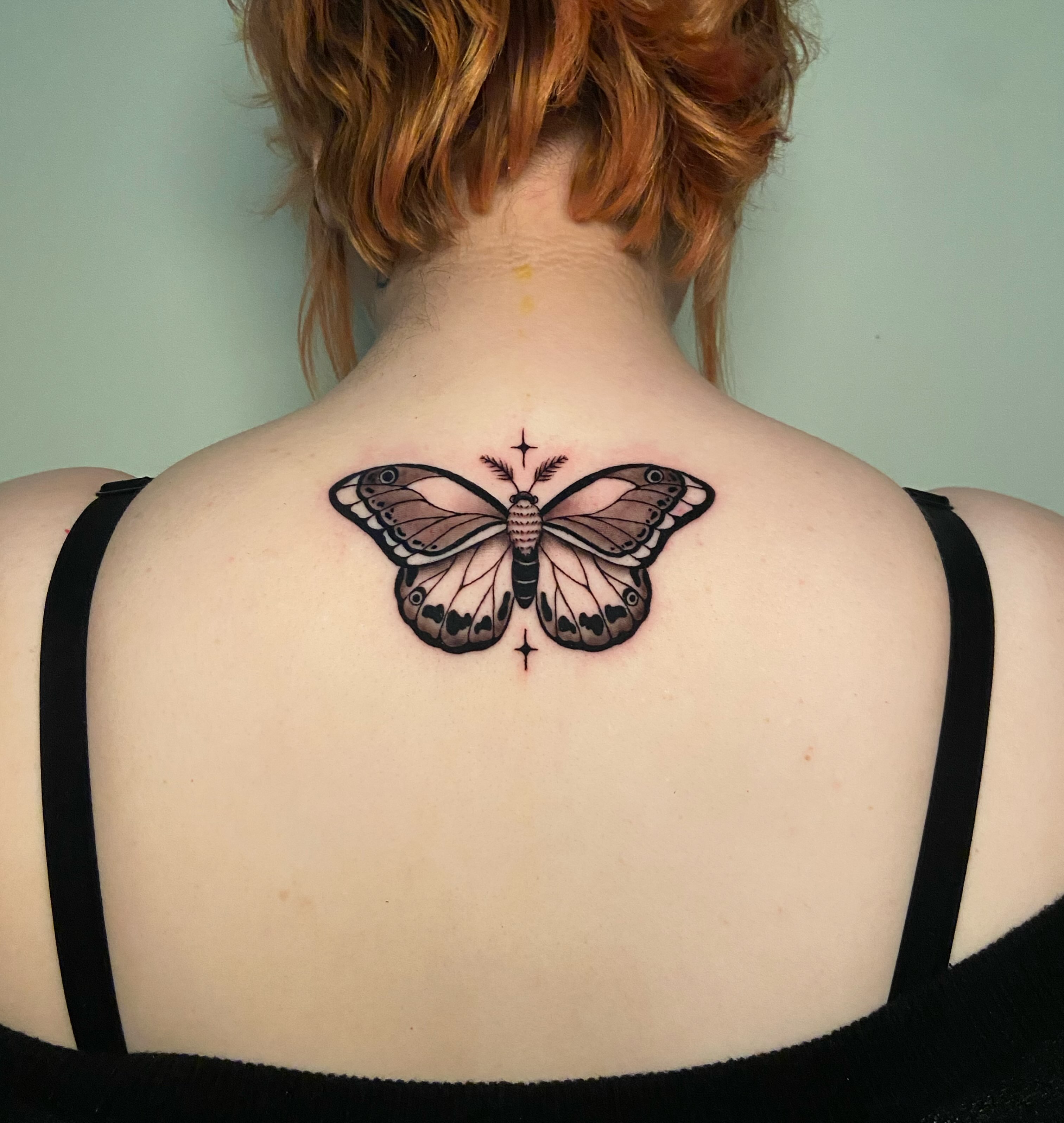 Butterfly realism tattoo on the back by Ezra Gonda