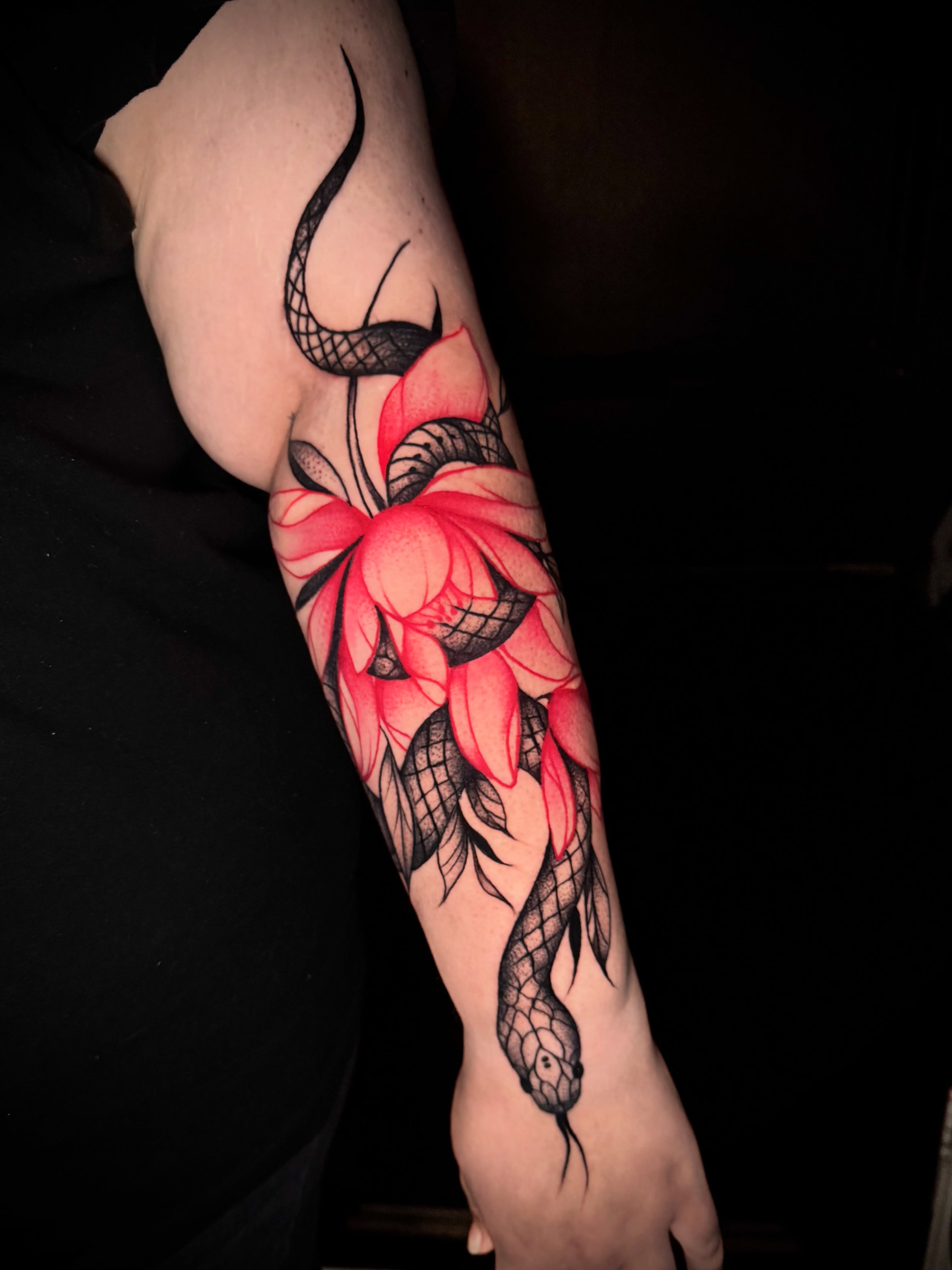 Lotus flower and snake realism tattoo on the forearm by Tattoo Artist based in Dallas Tx