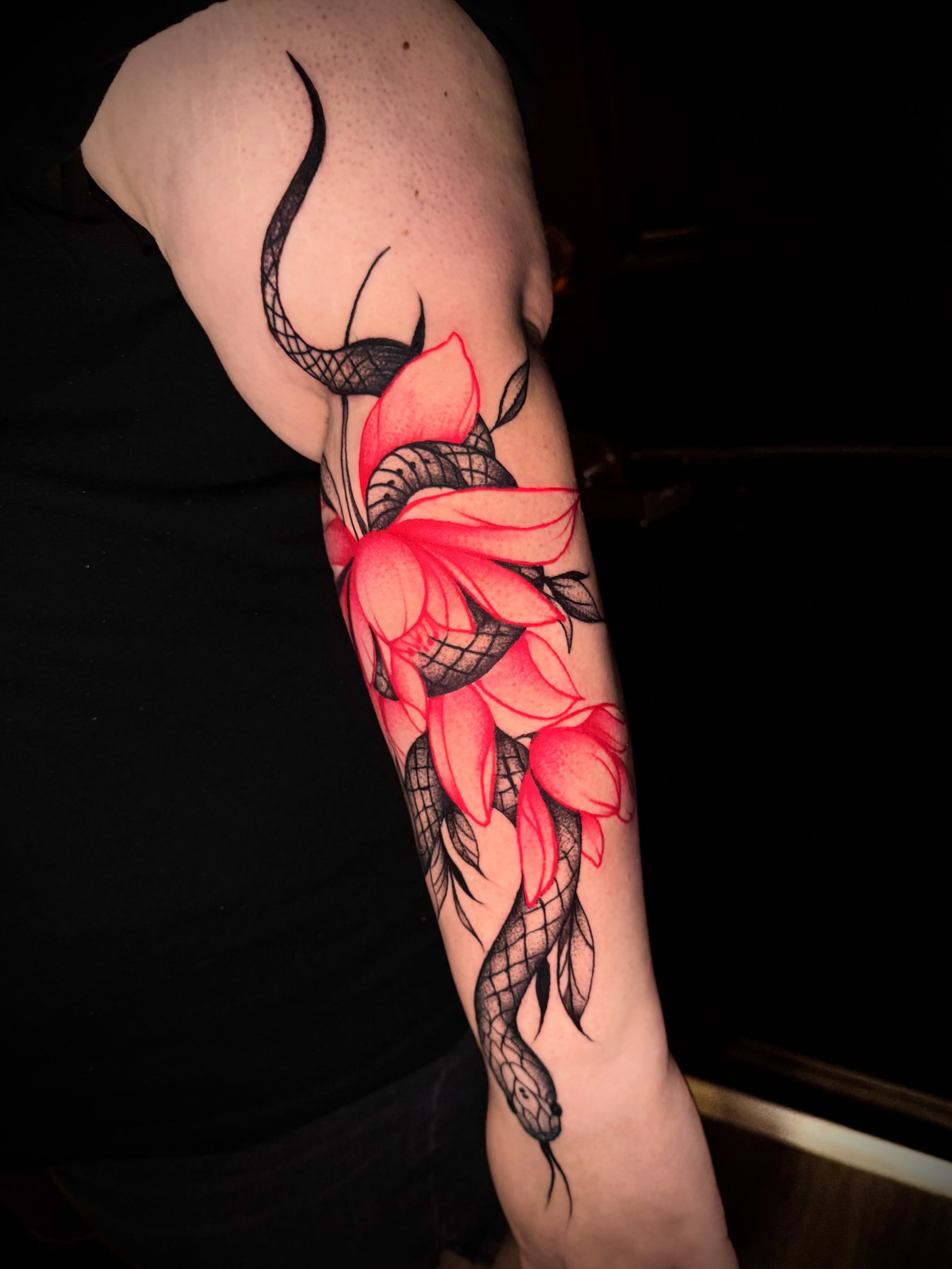 Snake and lotus geometric tattoo on the forearm by Tattoo Artist based in Dallas Tx