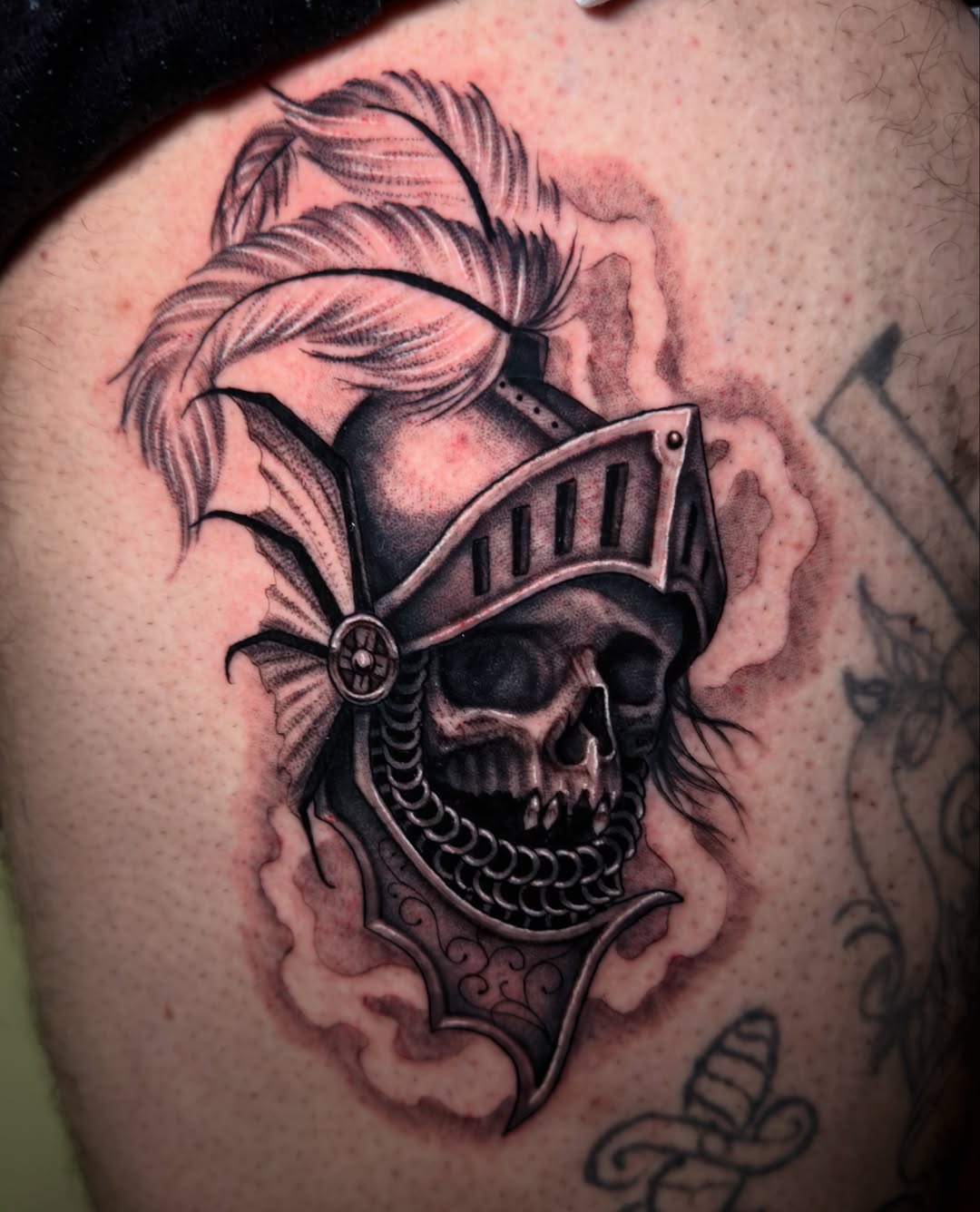 Skull in armor realism tattoo on the torso by Marisa Biddle