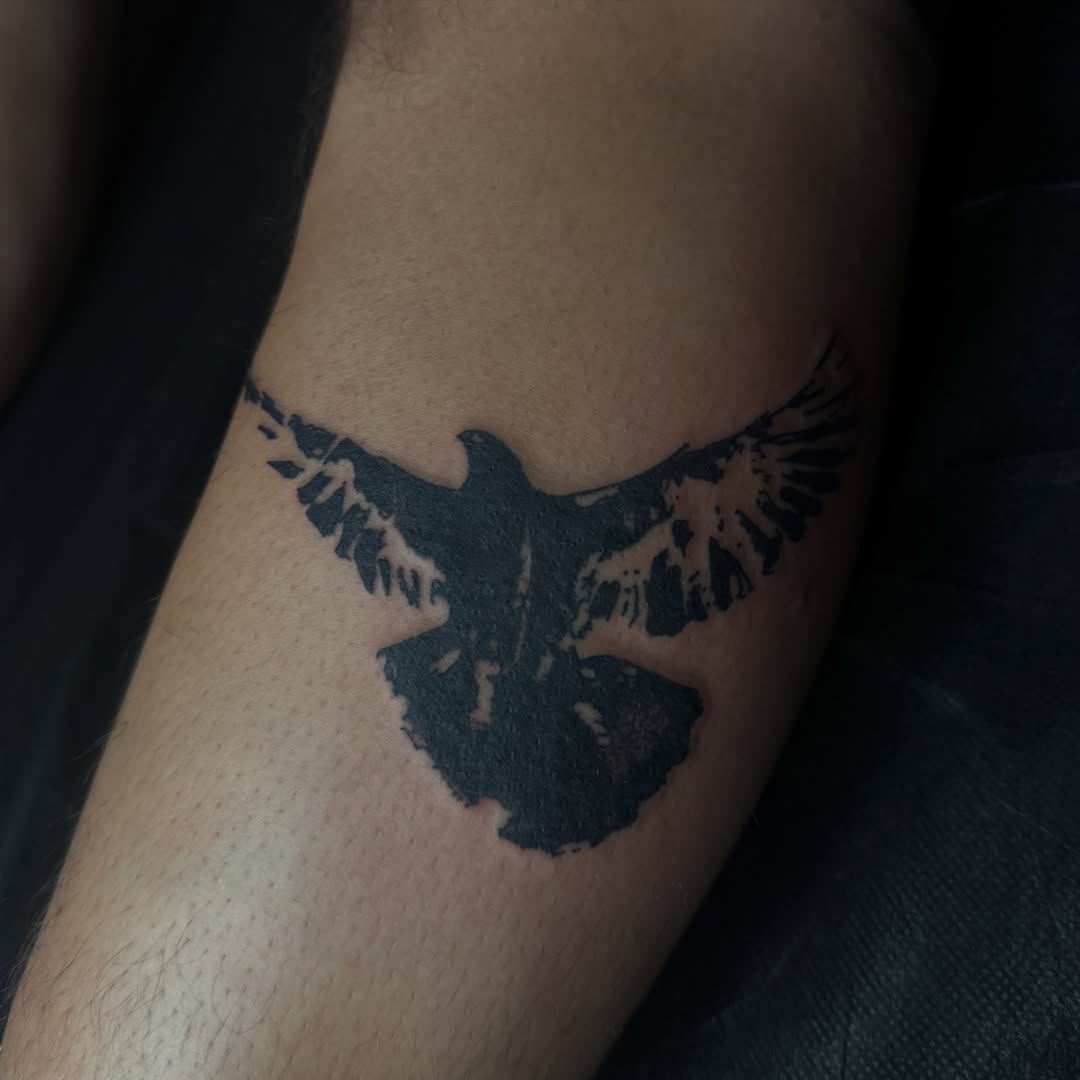 Bird black and grey tattoo on the forearm by Jordan Sandoval