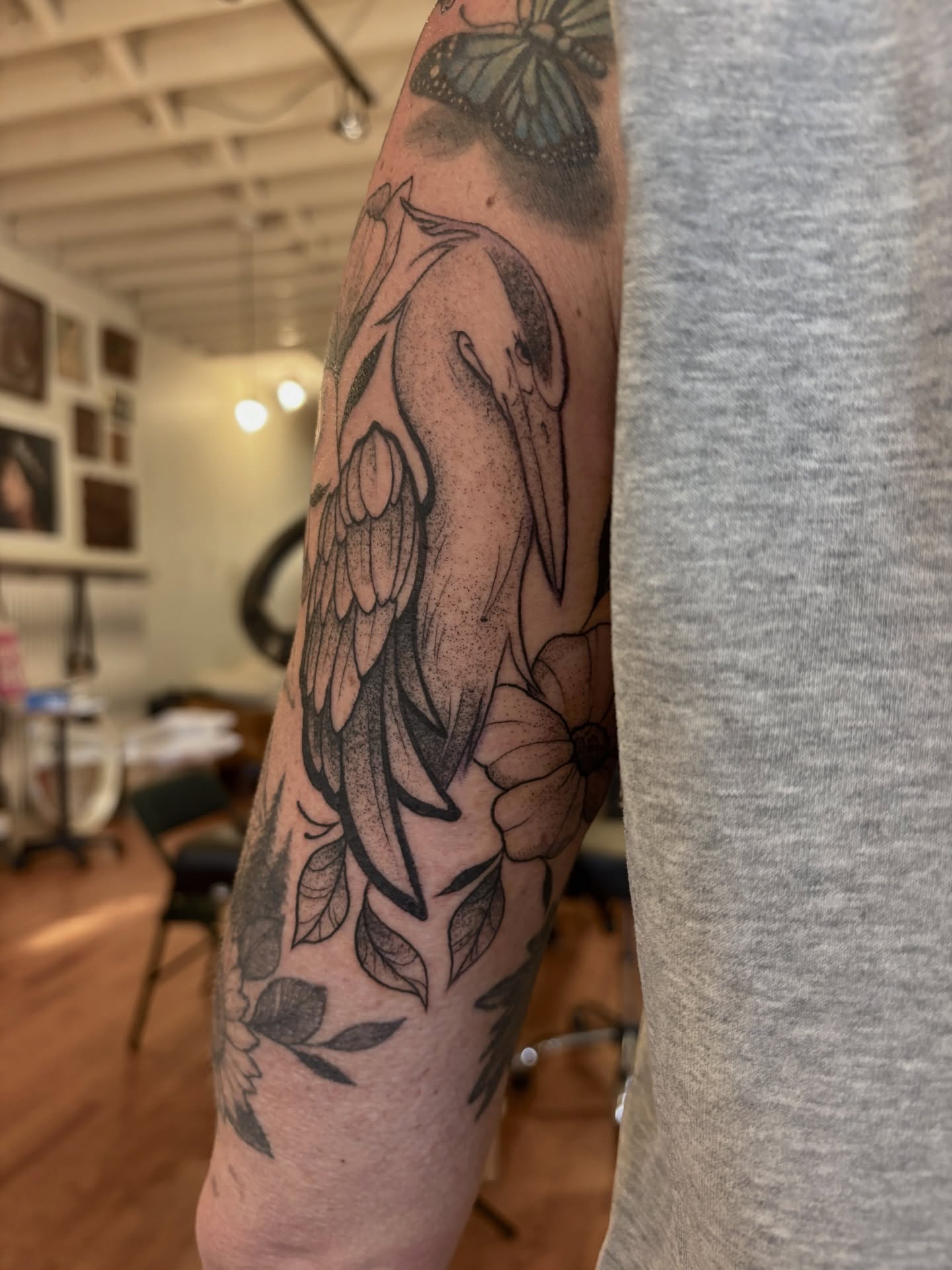 Dolphin and flowers black and grey tattoo on the forearm by V ☆ Cincinnati Tattoo Artist