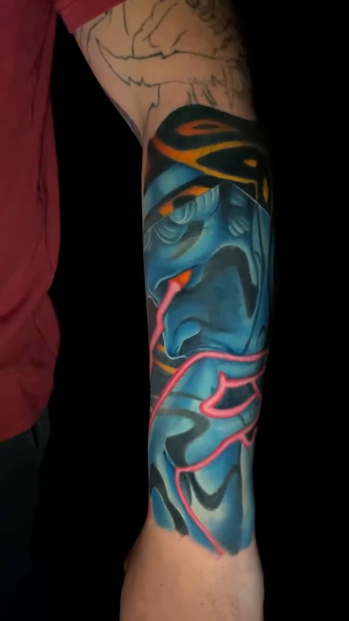 Blue demon face with pink lightning japanese irezumi tattoo by Brandon Bowie