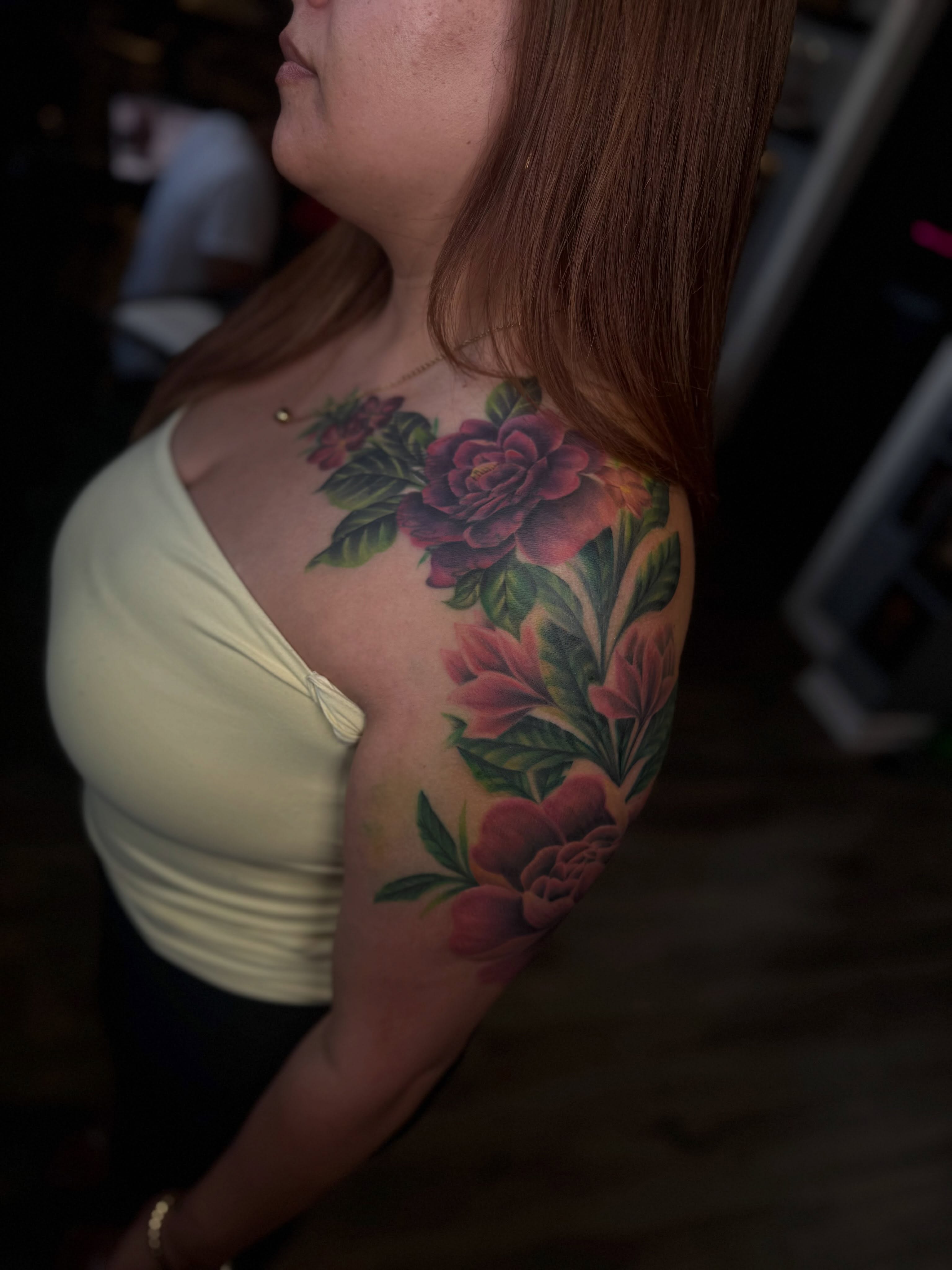 Floral bouquet realism tattoo on the shoulder by Stephanie Cruz, Kansas City, Missouri