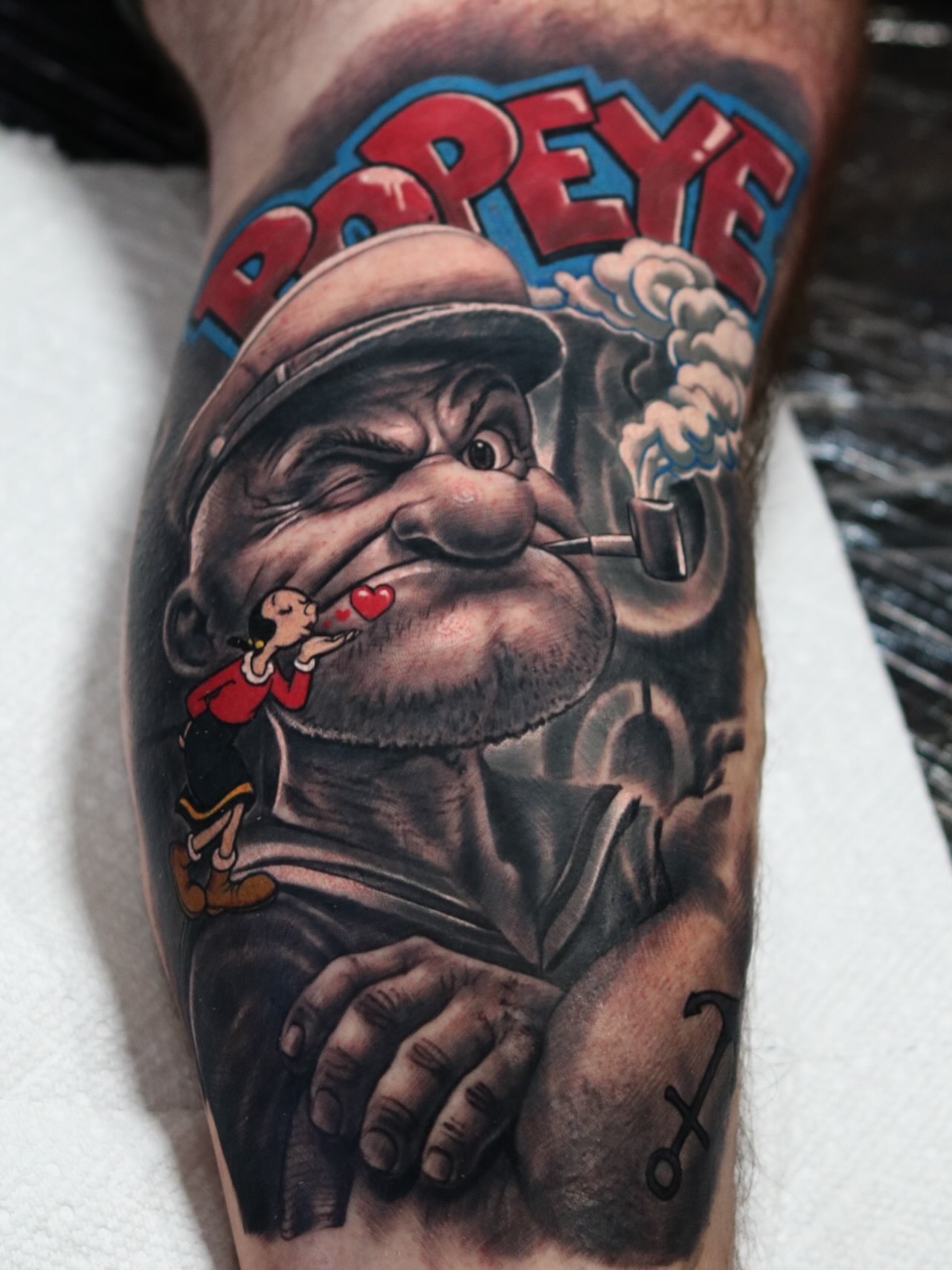 Popeye realism tattoo on the forearm by Luis Meneses