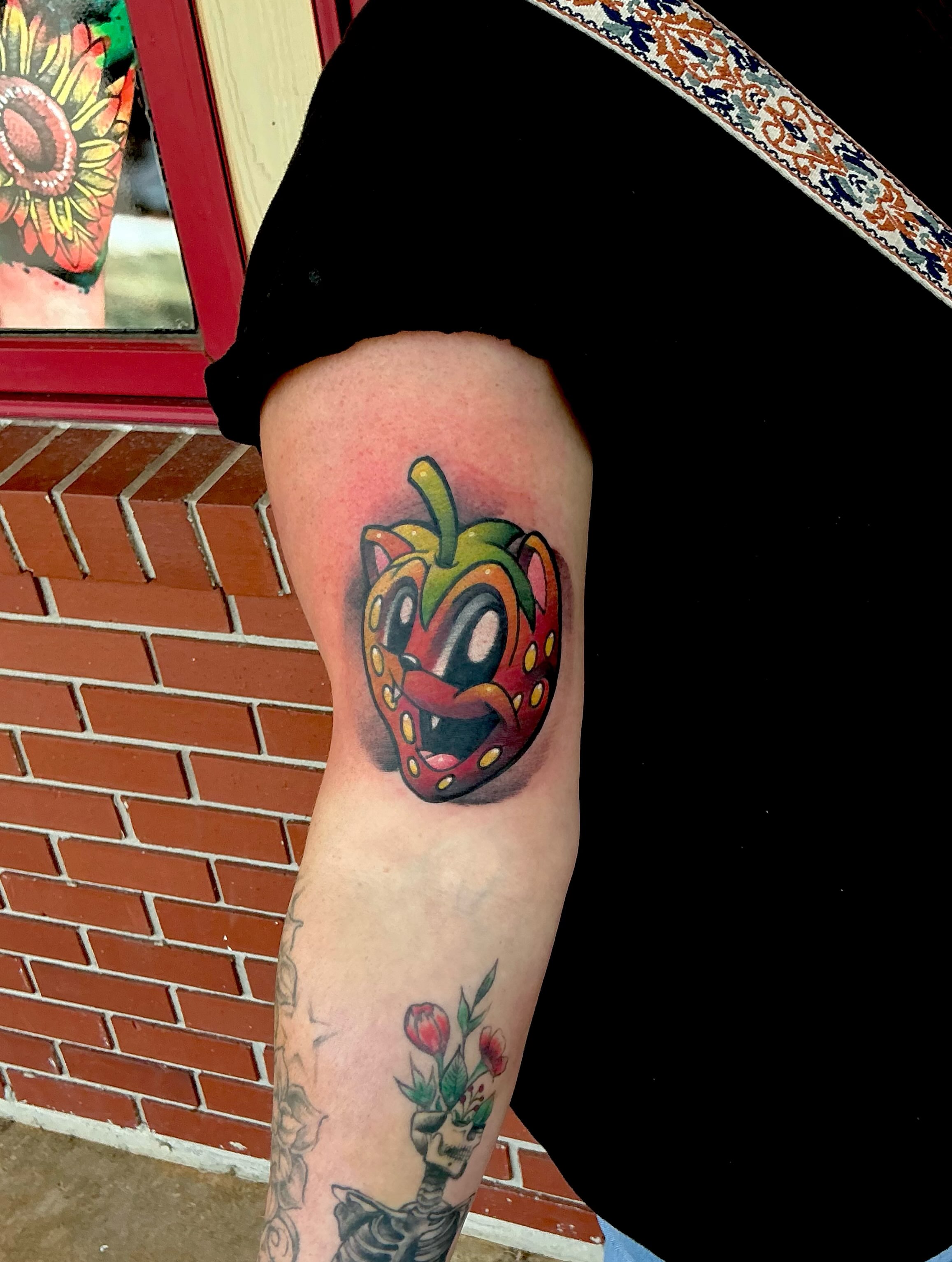 Apple trash polka tattoo on the thigh by Jeremy Harburn, Young Harris, Georgia
