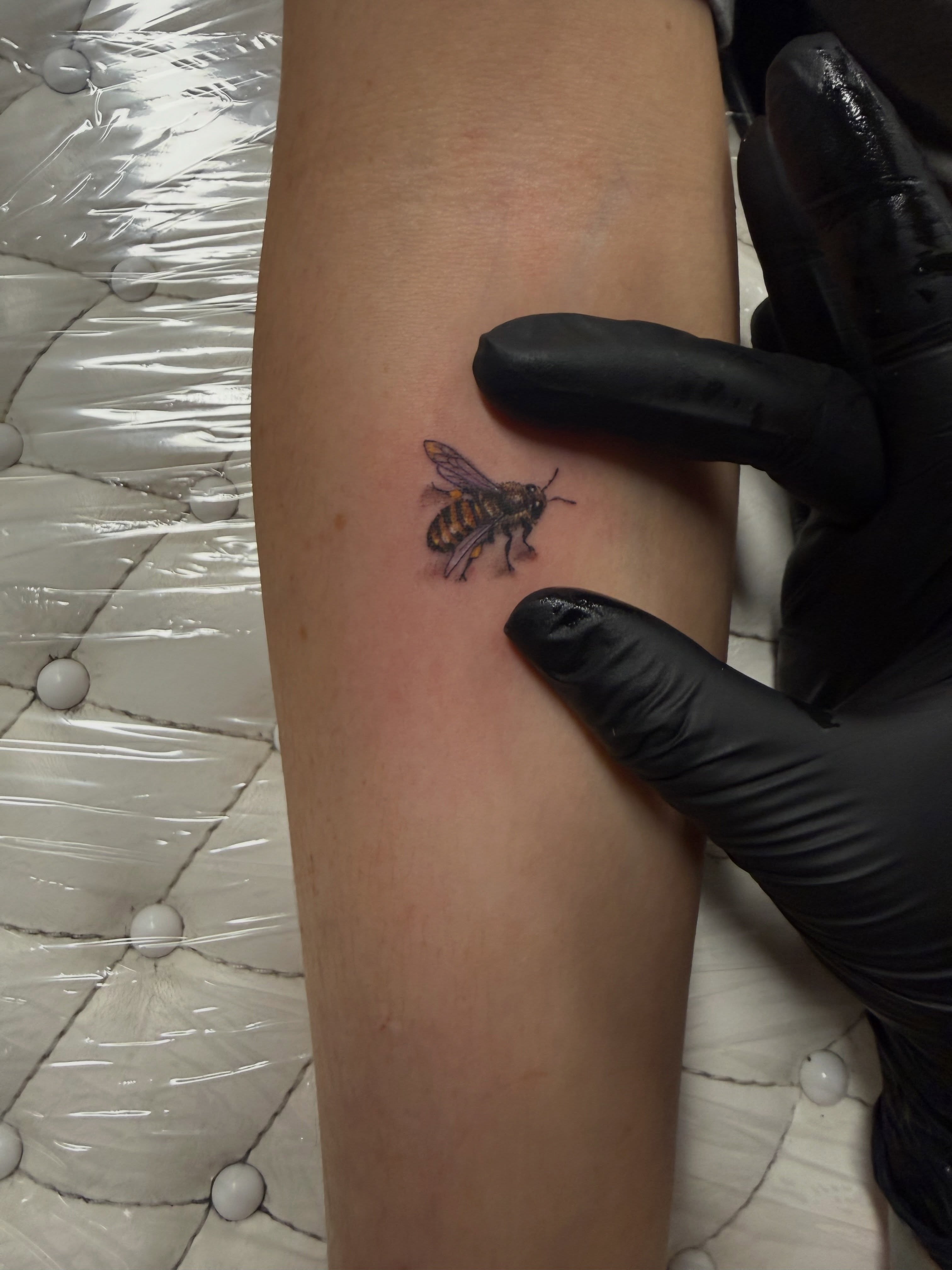 Bee realism tattoo on the forearm by Chelsea Speirs
