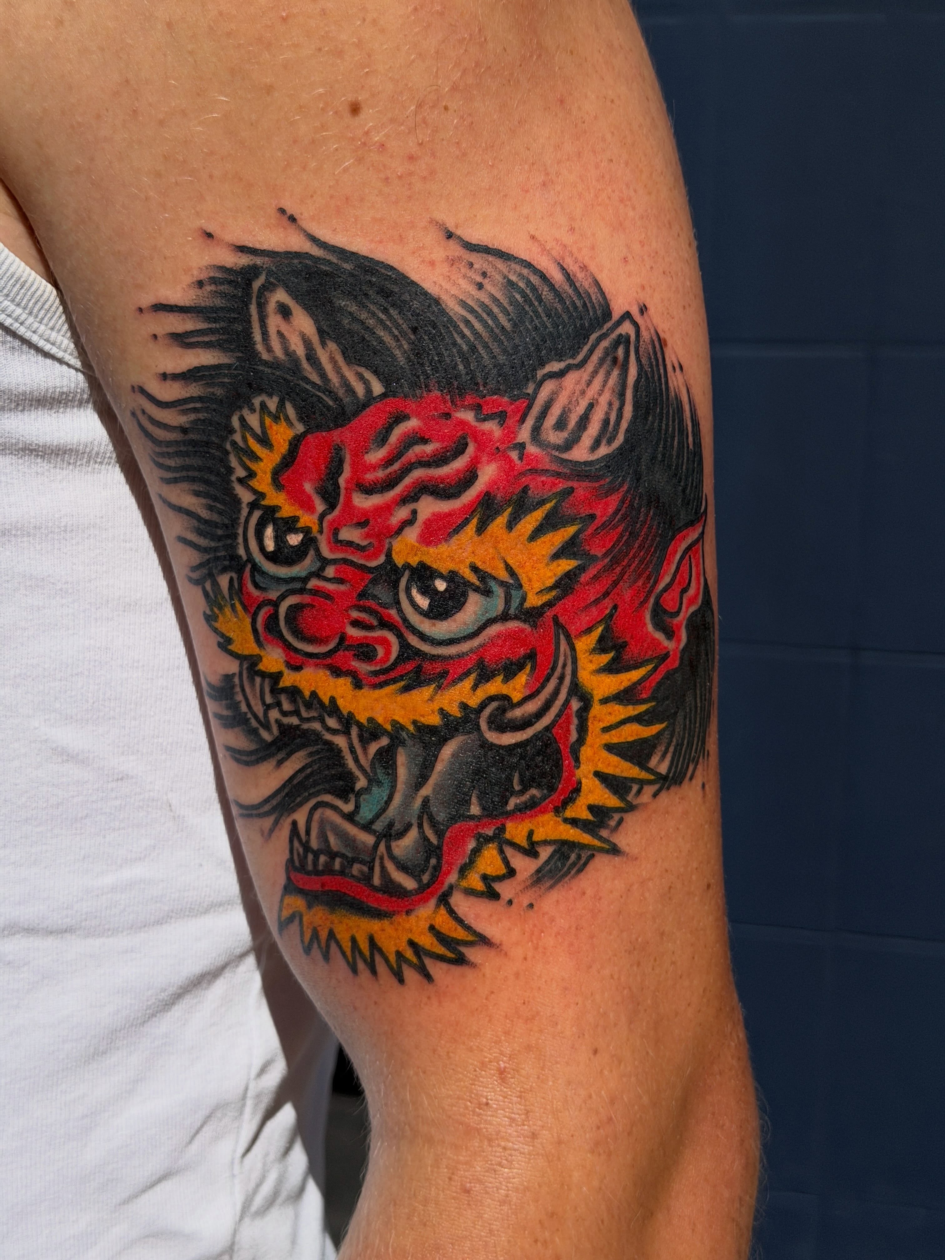 Demon head American traditional tattoo on the forearm by Joshua Speight
