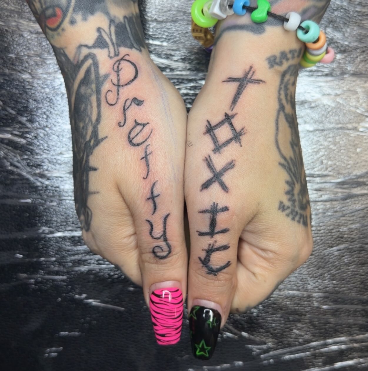 Lettering lettering script tattoo on the hand by BabyDoll, Dayton, Ohio