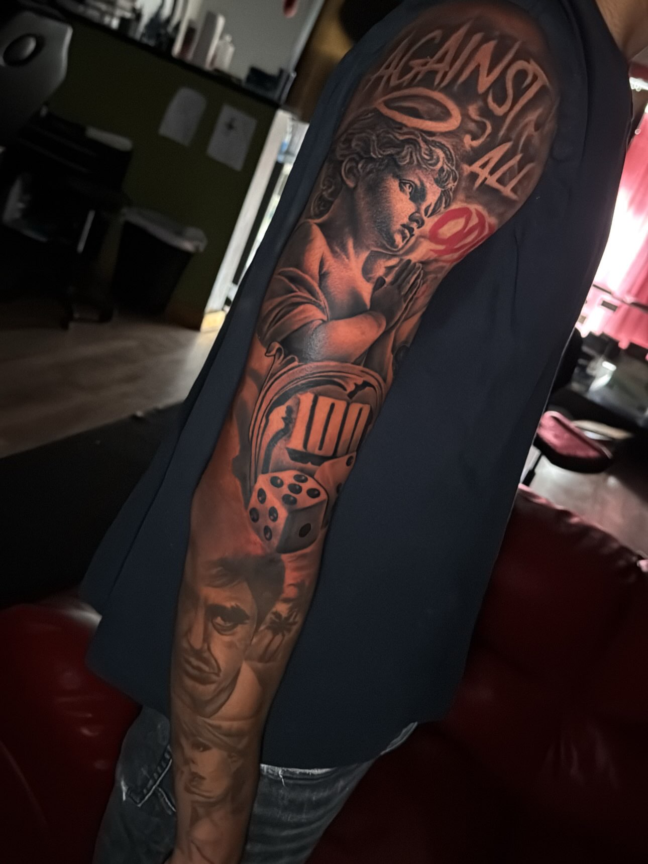 Religious figure with dice realism tattoo on the forearm by Cedric Fleming