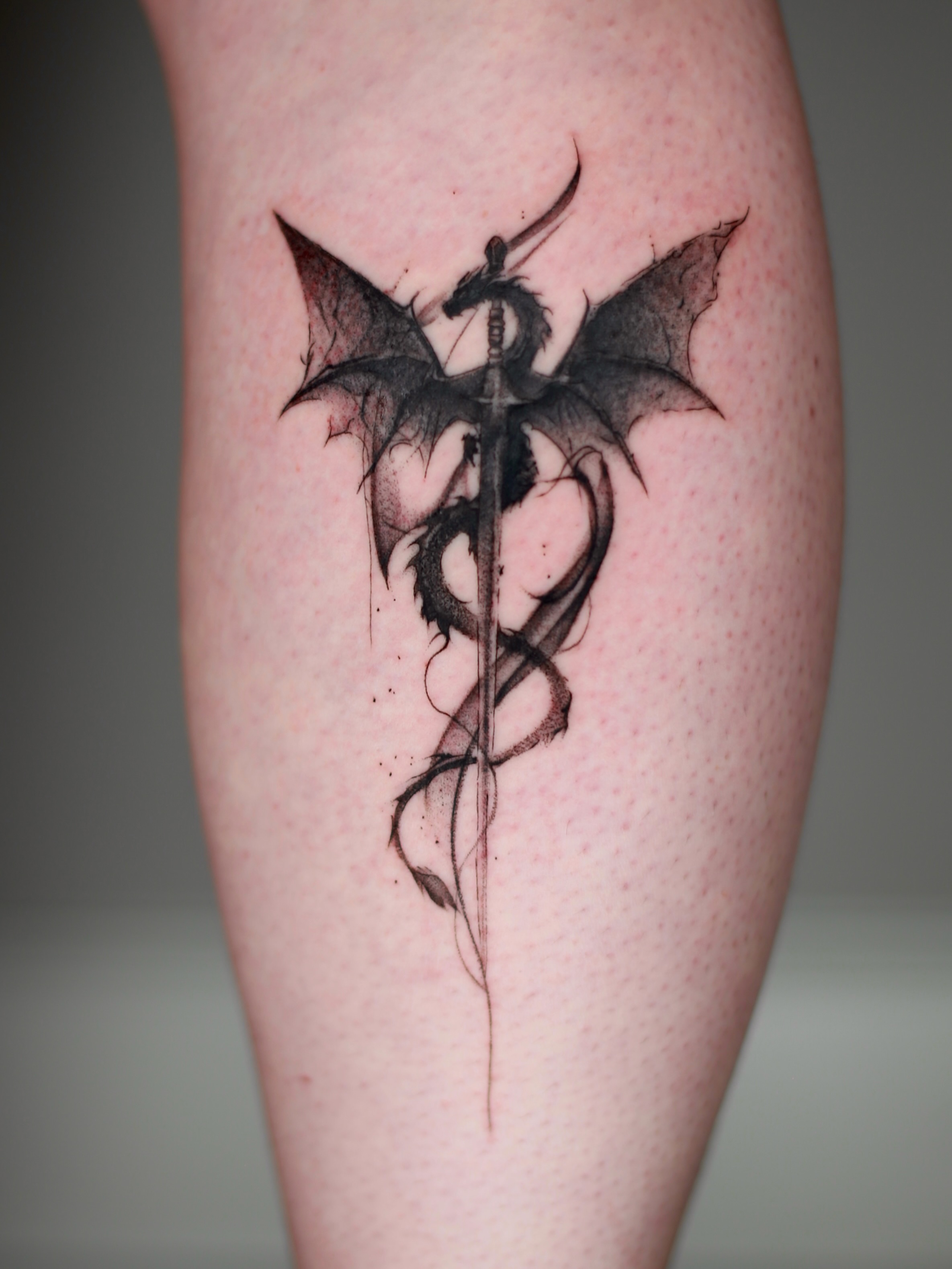 Dragon and sword dotwork tattoo on the forearm by Abi