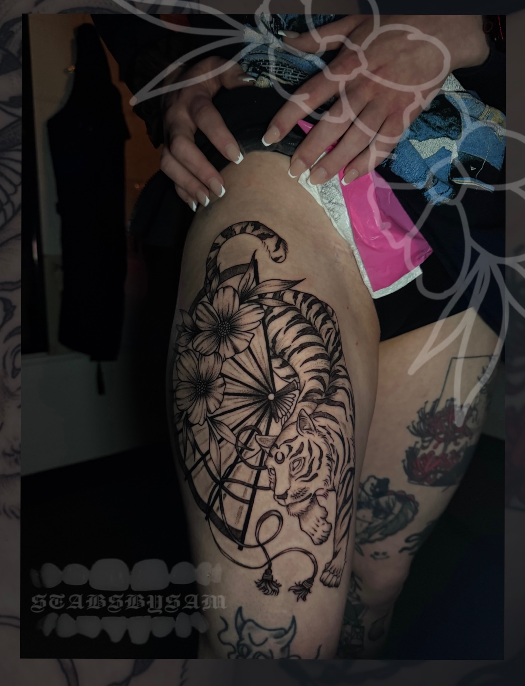 Tiger and lotus geometric tattoo on the thigh by licensed charlotte tattoo artist