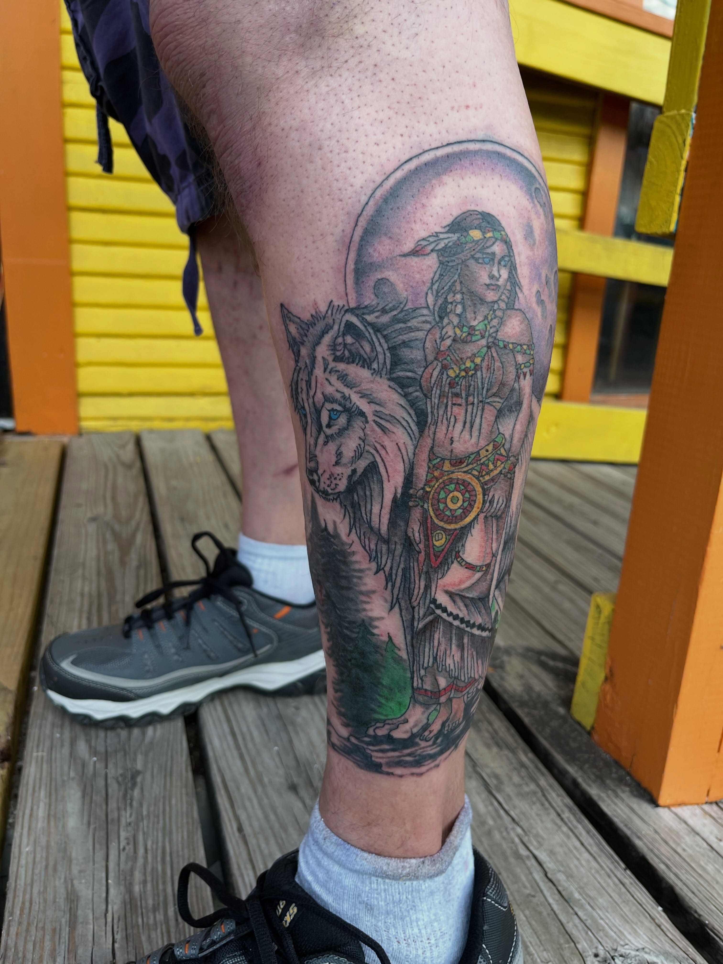 Indian woman and wolf American traditional tattoo on the thigh by Roachrude