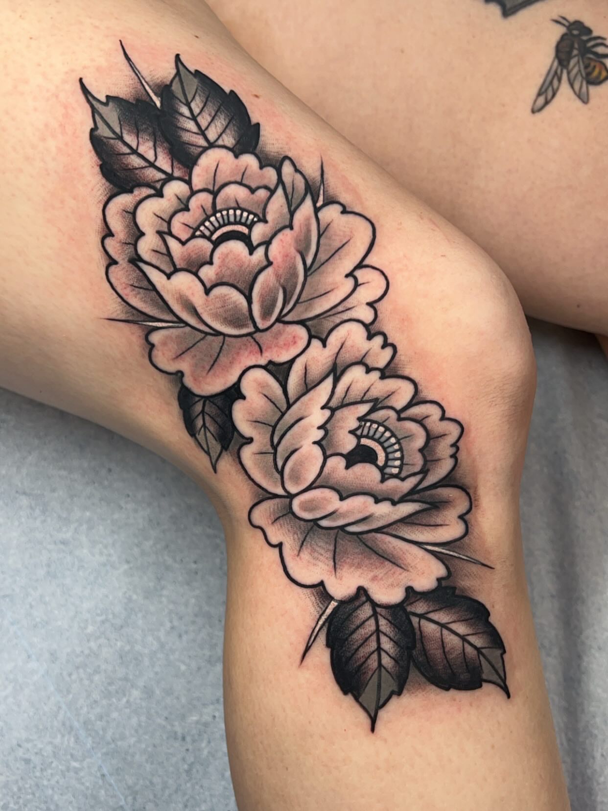 Peony flowers American traditional tattoo on the forearm by Mat Helton, Fairborn, Ohio