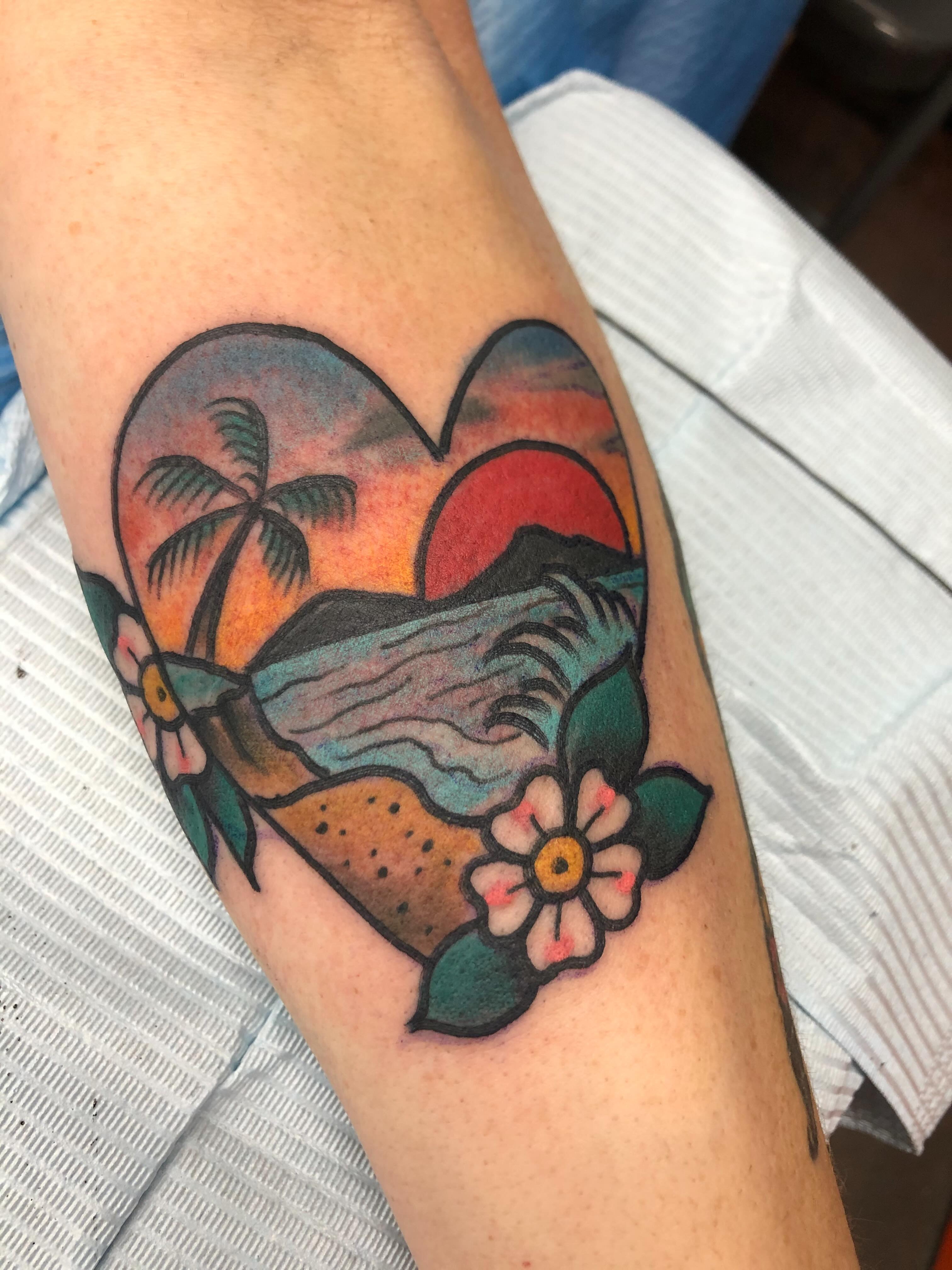 Sunset beach scene American traditional tattoo on the forearm by Mat Helton, Fairborn, Ohio