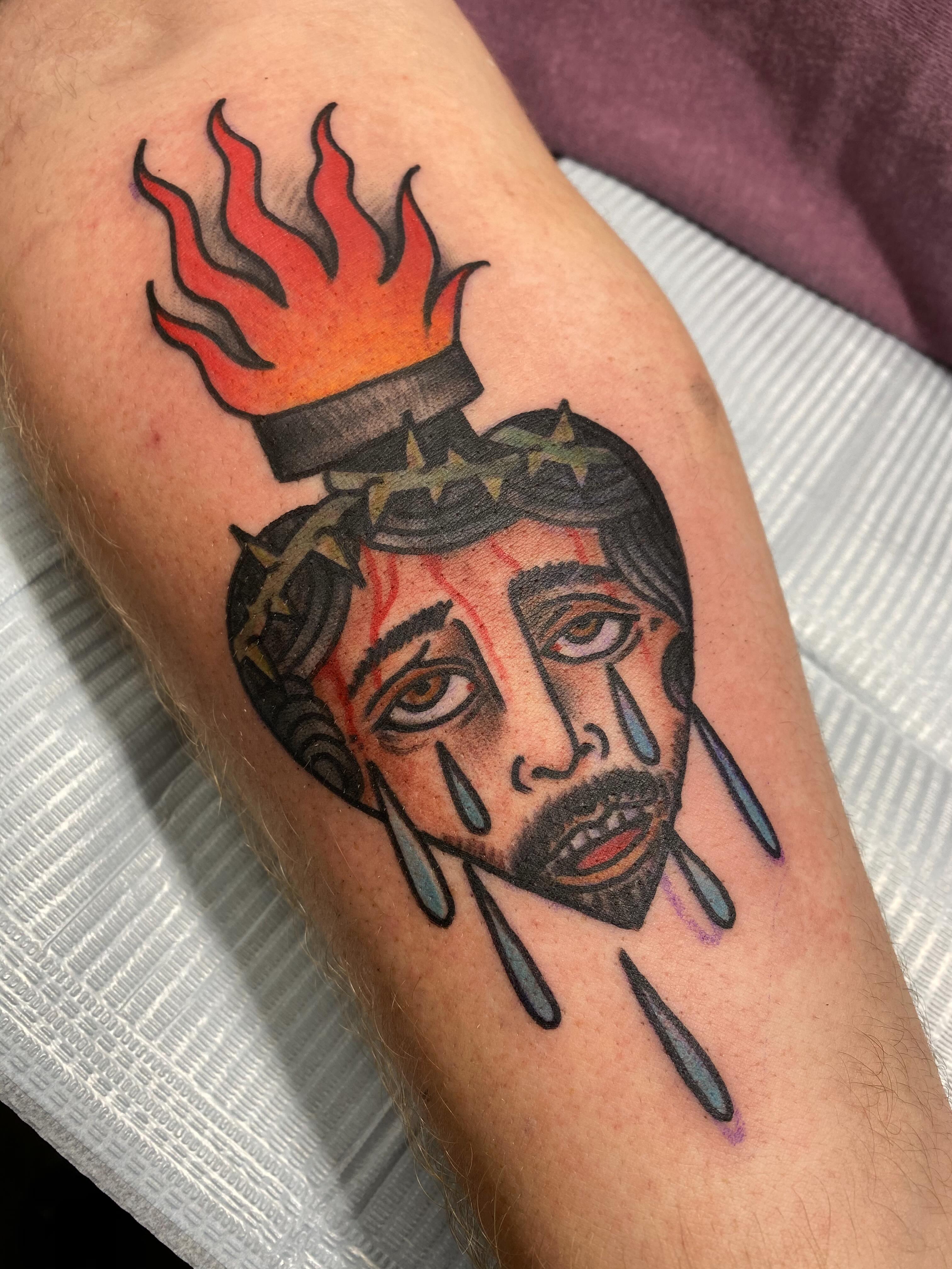 Crying jesus head American traditional tattoo on the forearm by Mat Helton, Fairborn, Ohio