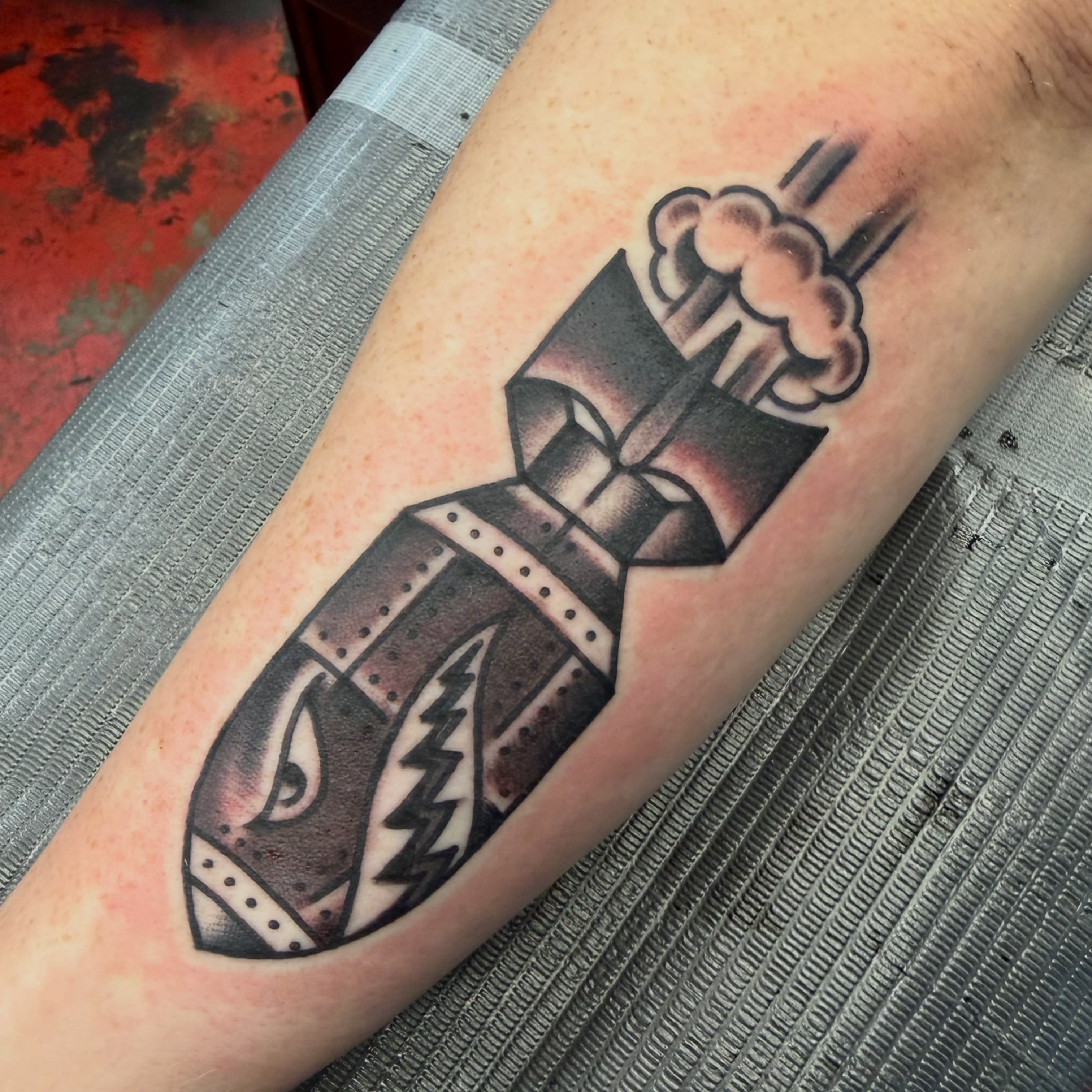 Bomb black and grey tattoo on the forearm by Max mogstad