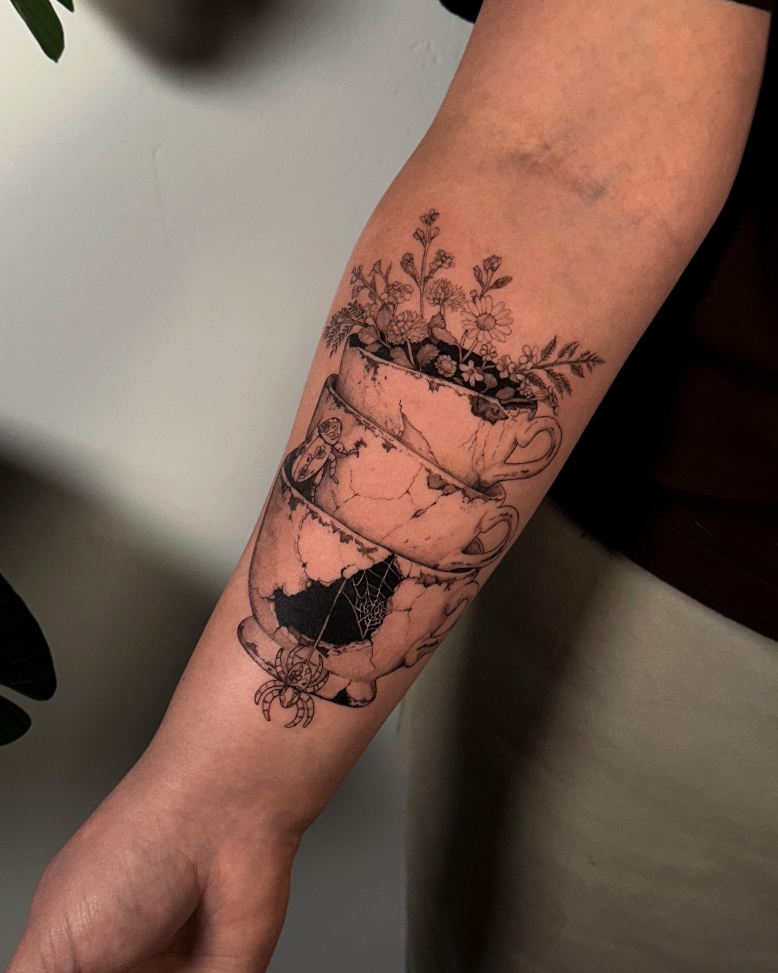 Flower pot black and grey tattoo on the forearm by Caroline + Utah Tattoo Artist