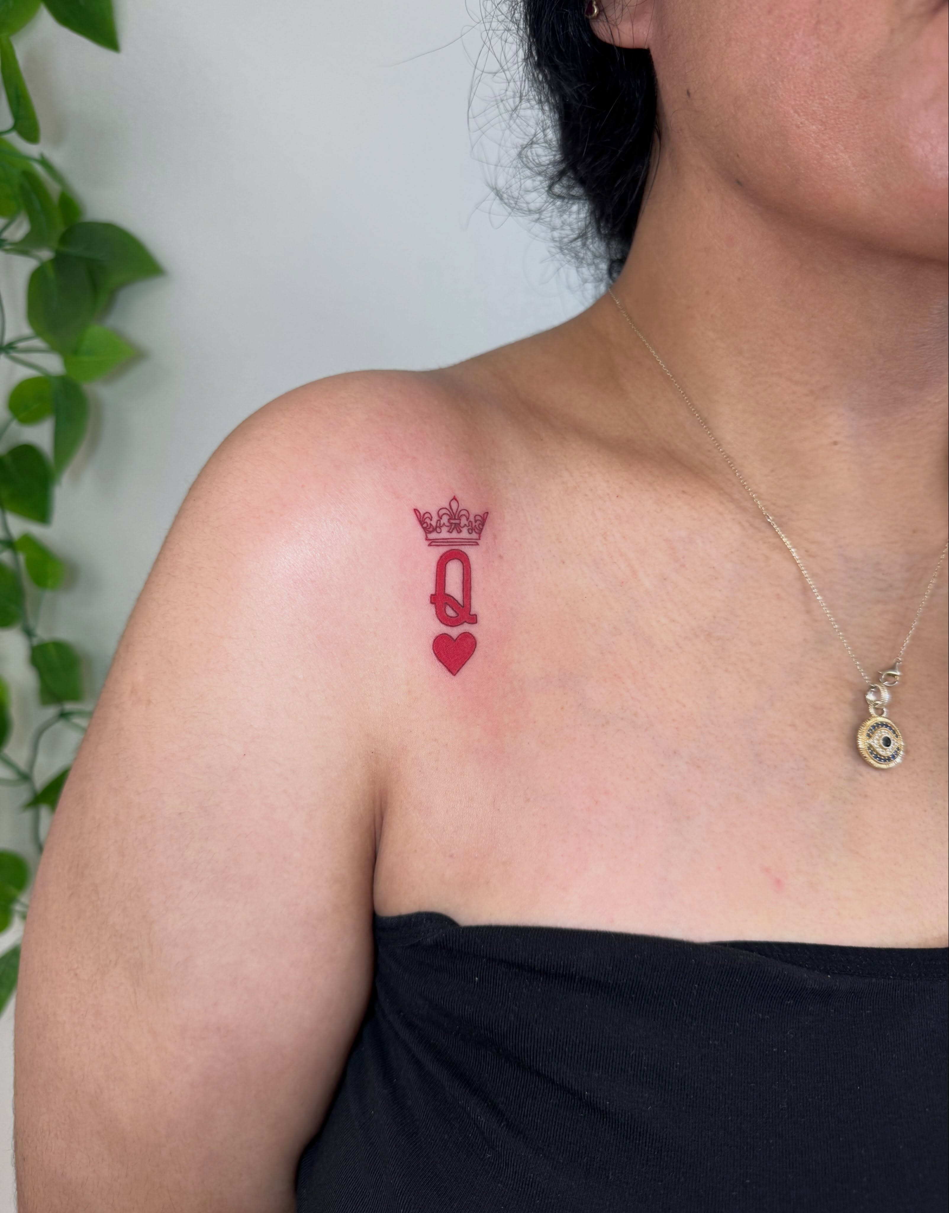 Queen of hearts lettering script tattoo on the shoulder by Angela Nery, South Jordan, Utah