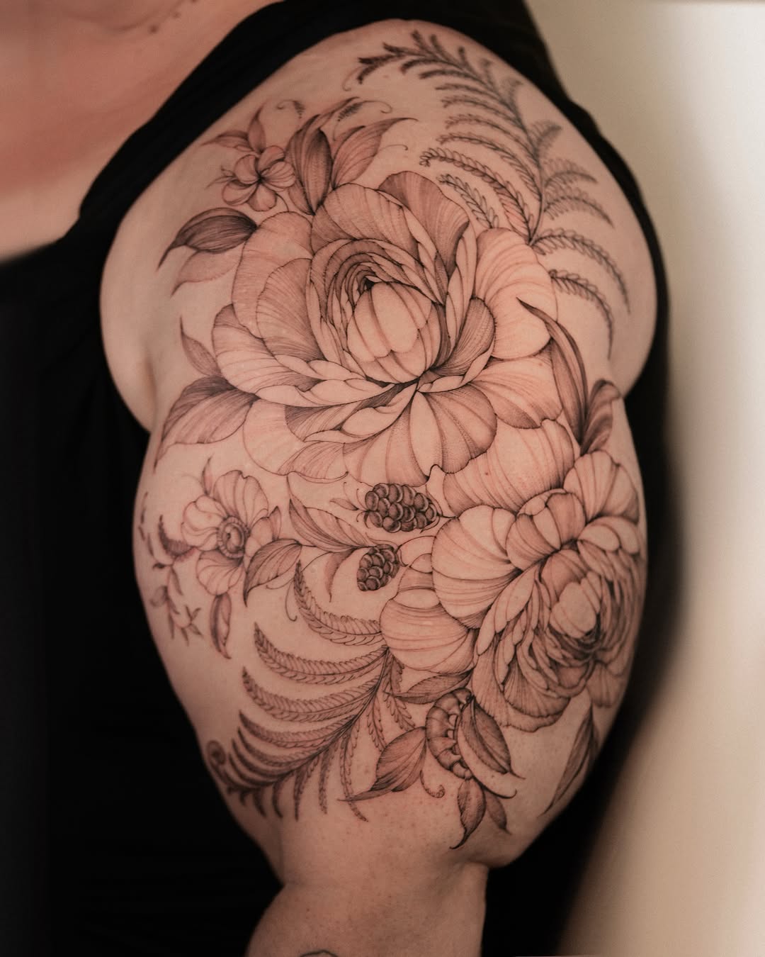 Floral bouquet realism tattoo on the shoulder by Zalina Loriia